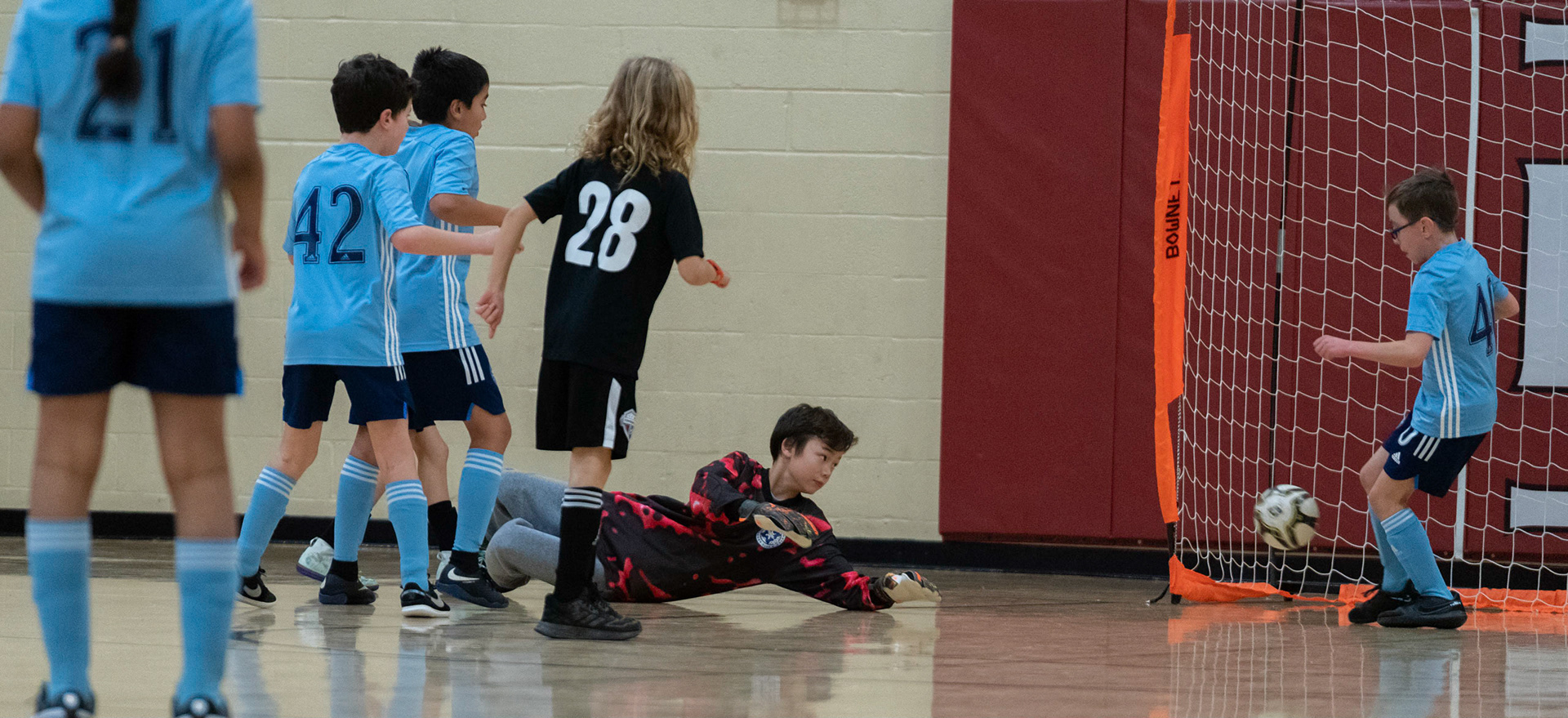 Jonah clears the ball from front of goal in the first half of the Mt. Washington Soccer 22/23 12-5 victory over  Towson United. Each player scored.