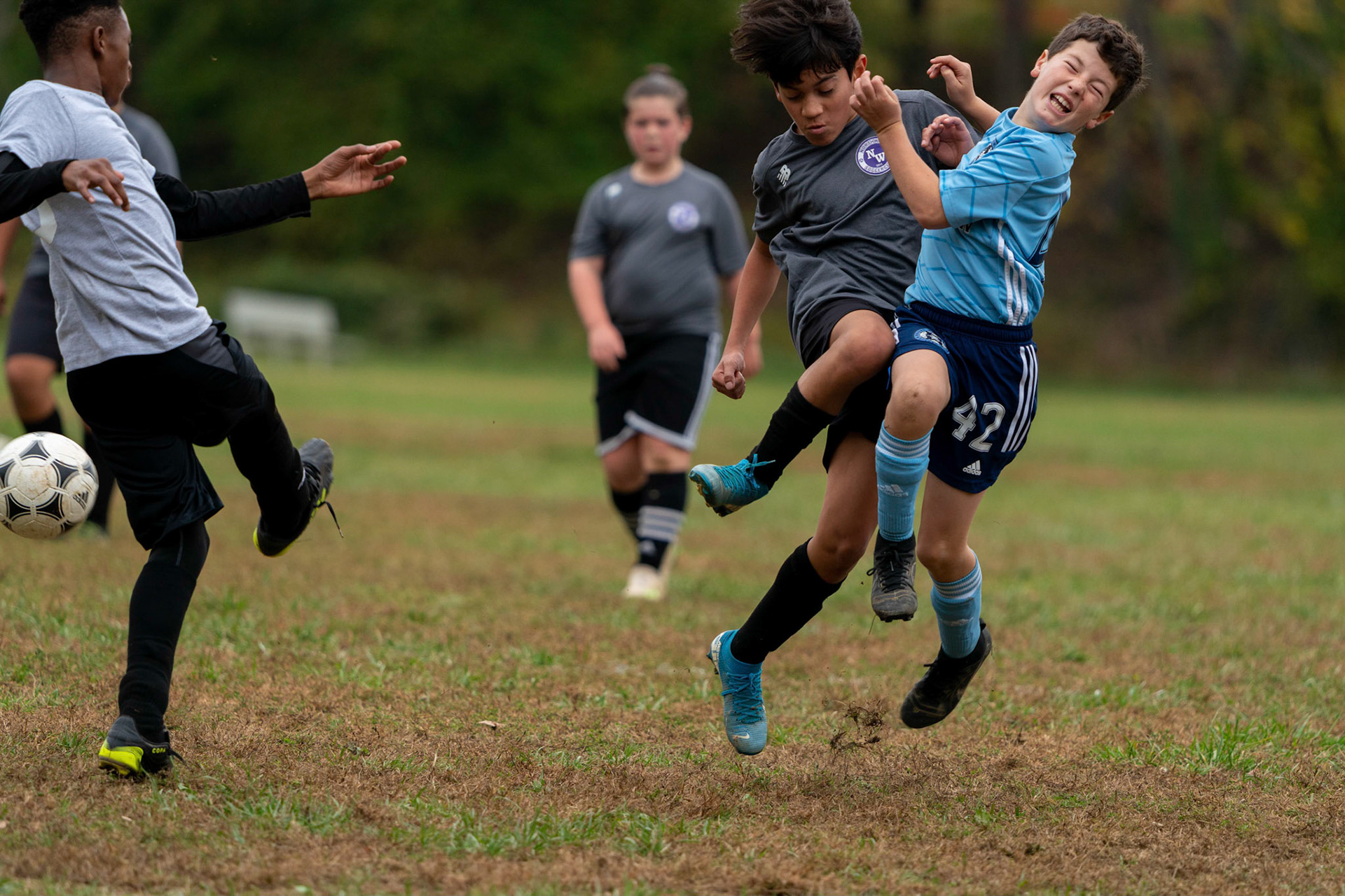 Cameron collides at midfield in a fight for control during the second half of Mt Washington's 3-1 home victory over Northwest SC on October 23, 2022.