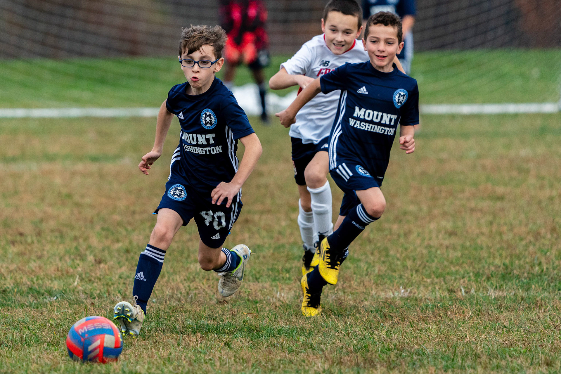 Jonah makes his way up field as Simon heads to the center to await a pass as Mt. Washington defeats Freedom SC 2-1 in their final game of fall 2022.