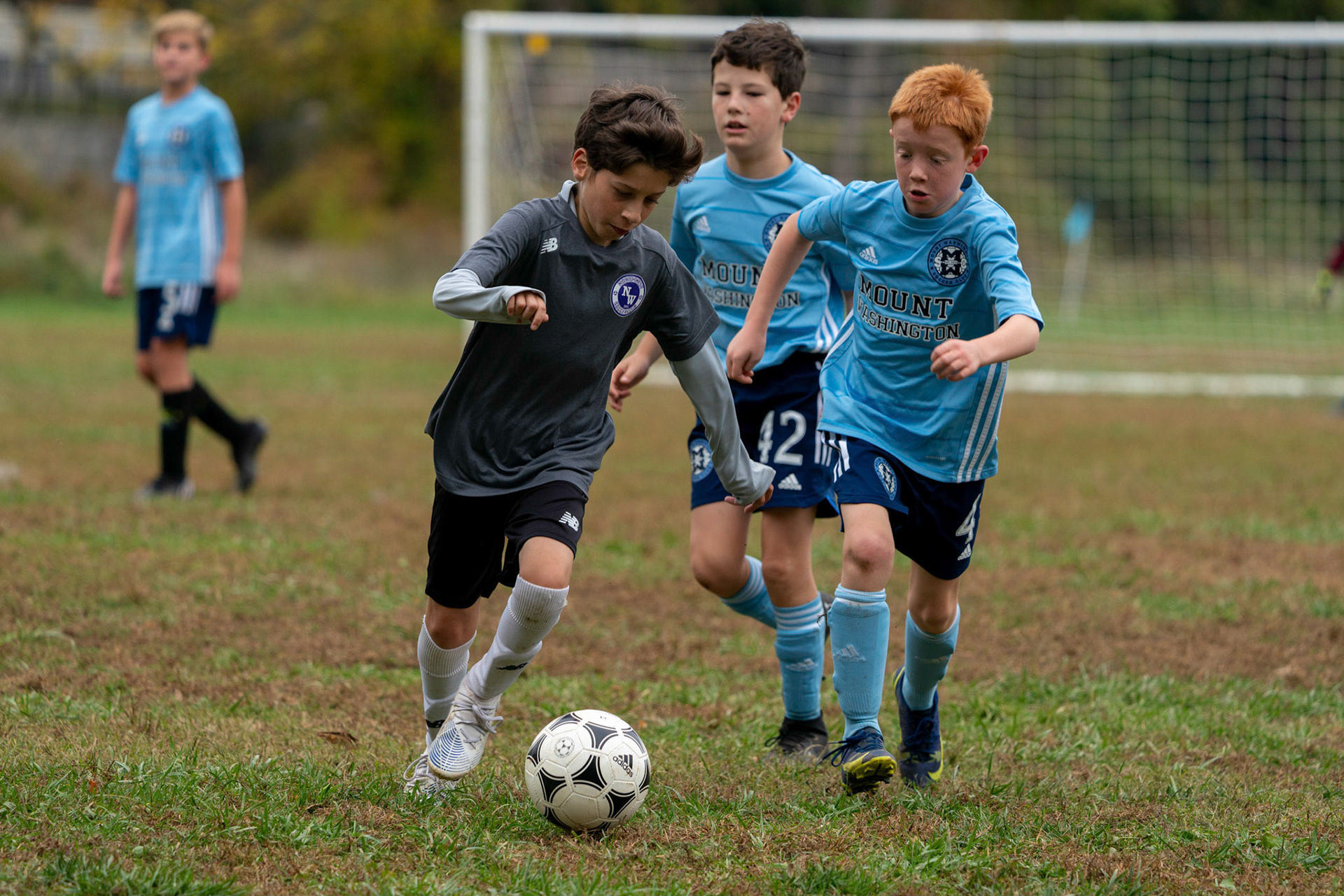 Calvin tries to keep Northwest SC from clearing the ball in their defensive end during the second half of Mt Washington's 3-1 home victory over Northwest SC on October 23, 2022.