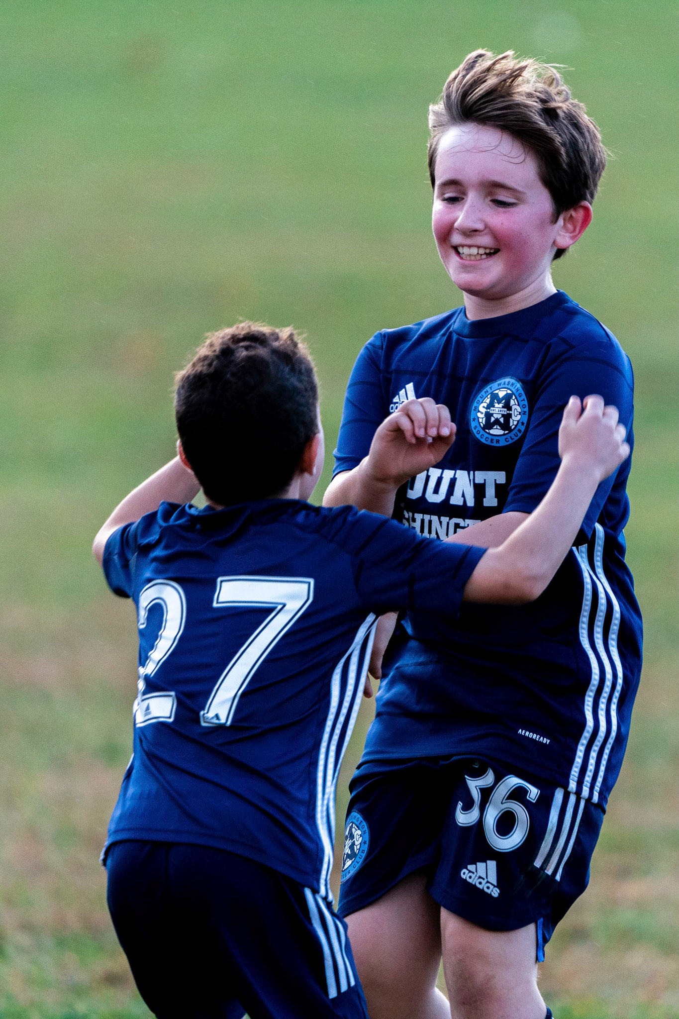 Simon runs to Graham at the end of their victory over Freedom SC 2-1.