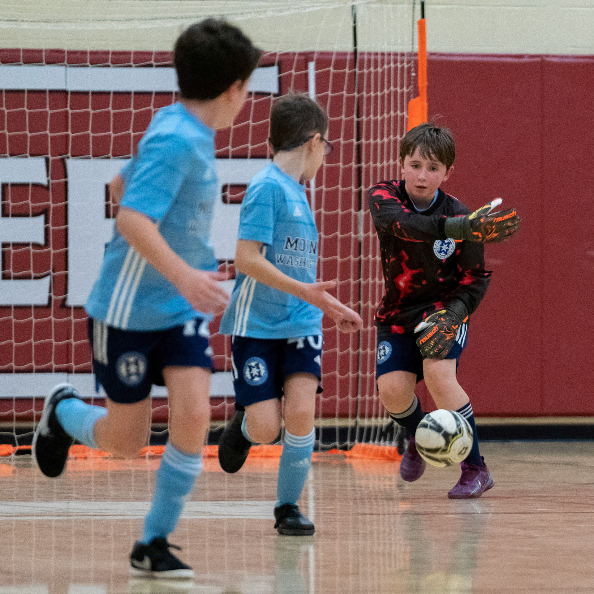 Graham releases the ball towards Jonah and Cameron in the second half of the Mt. Washington Soccer 22/23 12-5 victory over  Towson United. Each player scored.