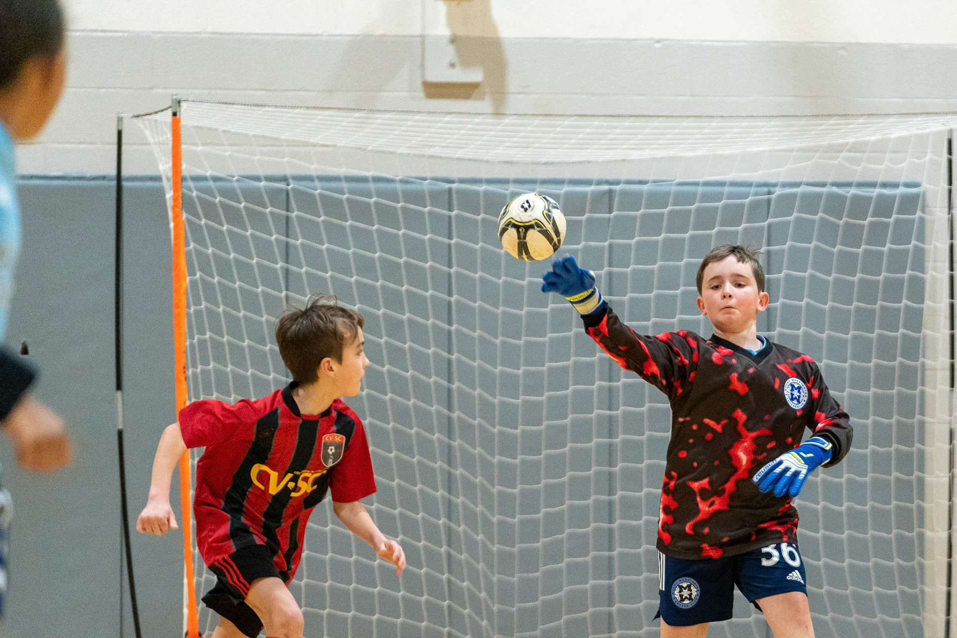 Graham looks to release Drake after a first half save in the Mt. Washington Soccer 22/23 11-3 victory over  Charles Village.