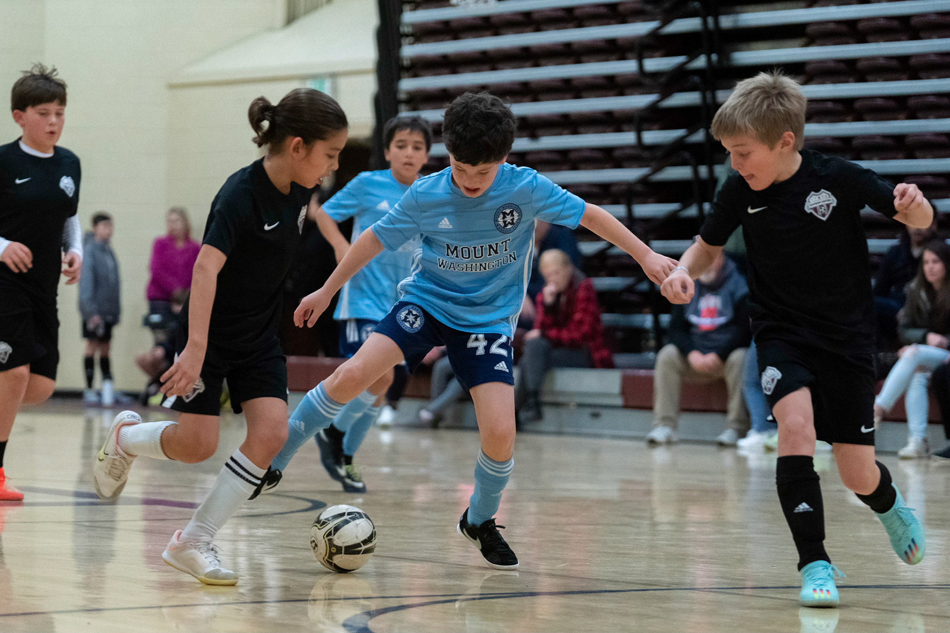 Cameron weaves through the defense in the second half of the Mt. Washington Soccer 22/23 12-5 victory over  Towson United. Each player scored.