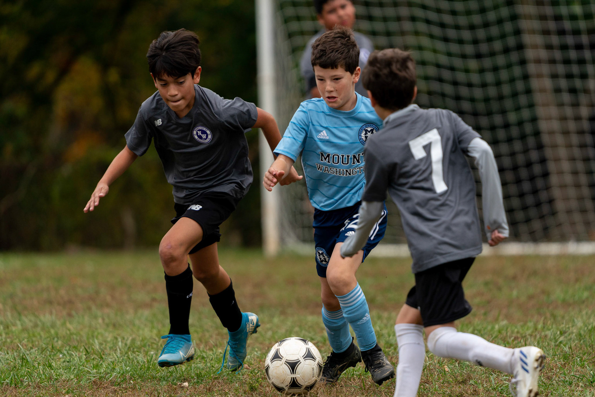 Cameron tries to thread the defense at midfield in the first half of Mt Washington's 3-1 home victory over Northwest SC on October 23, 2022.