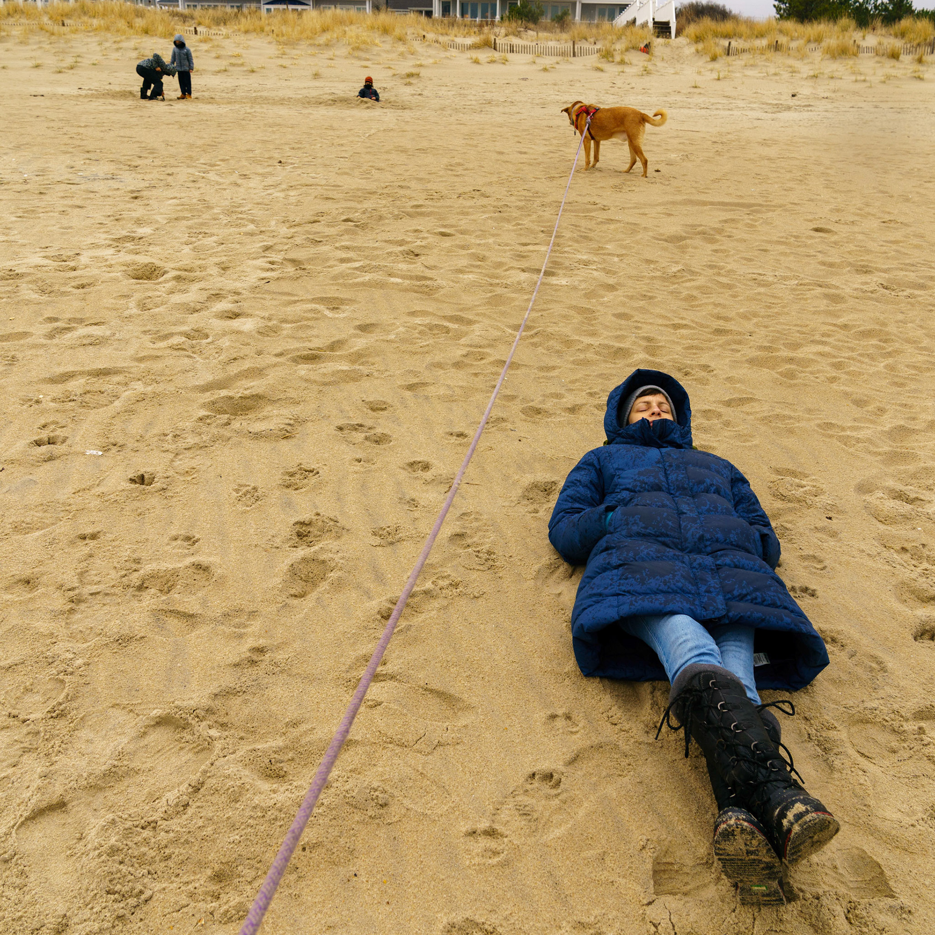 New Year’s trip to the beach. Playing at the beach. Buried little ones.