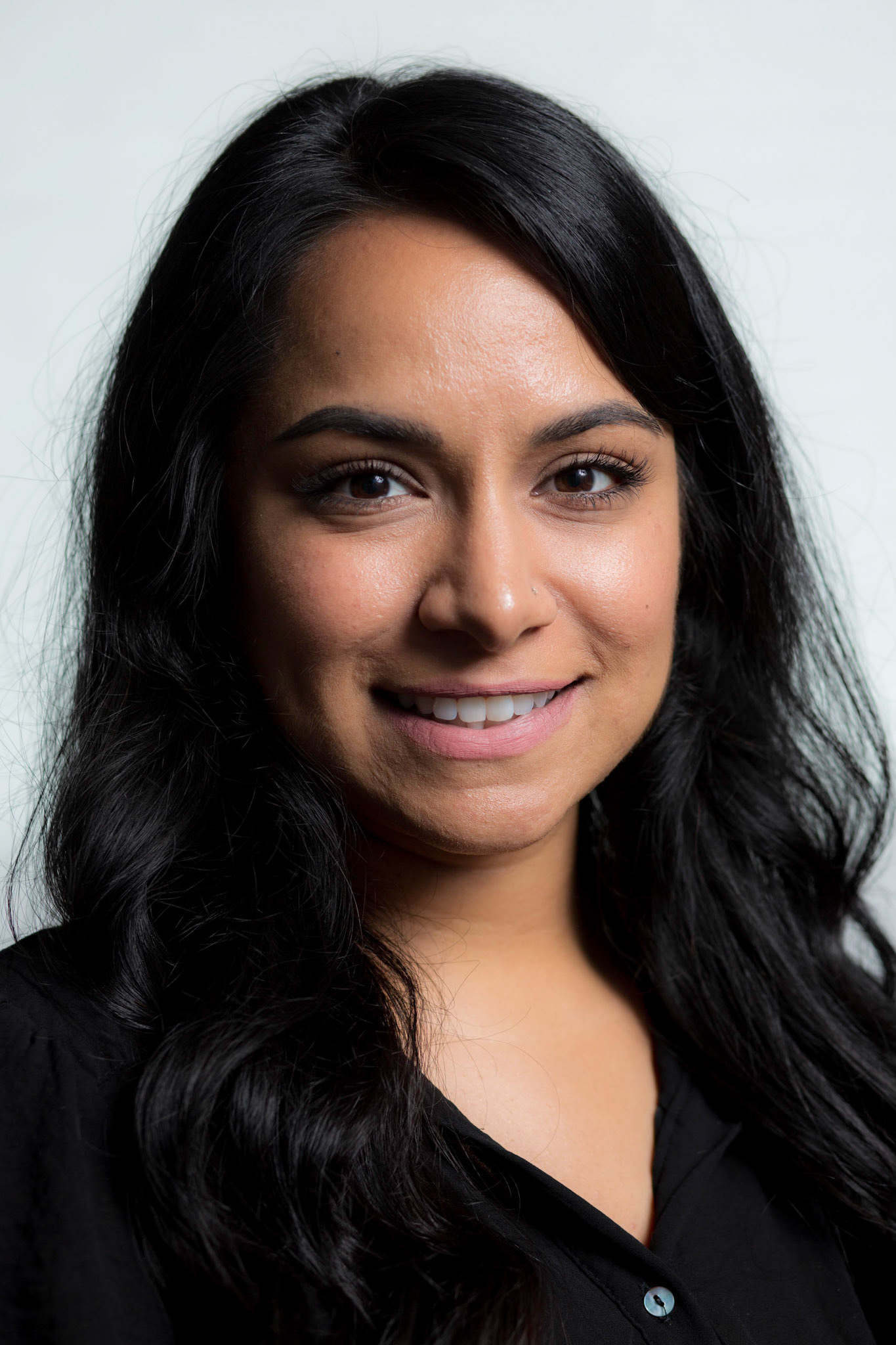 Portraits and headshots of Mikaela Seligman, CEO of AchieveMission.