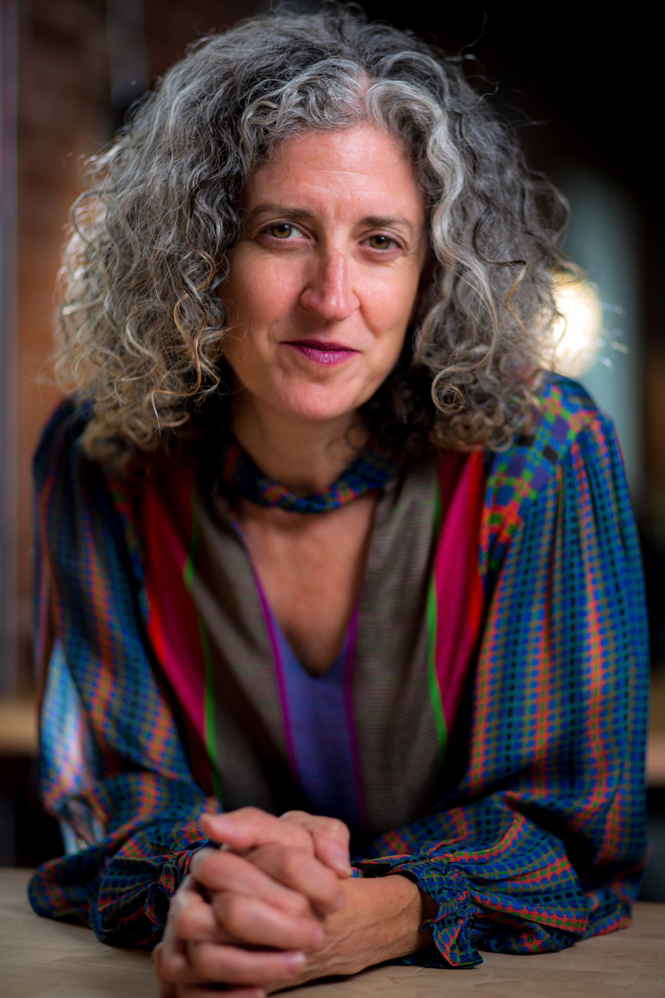 Portraits and headshots of Mikaela Seligman, CEO of AchieveMission.