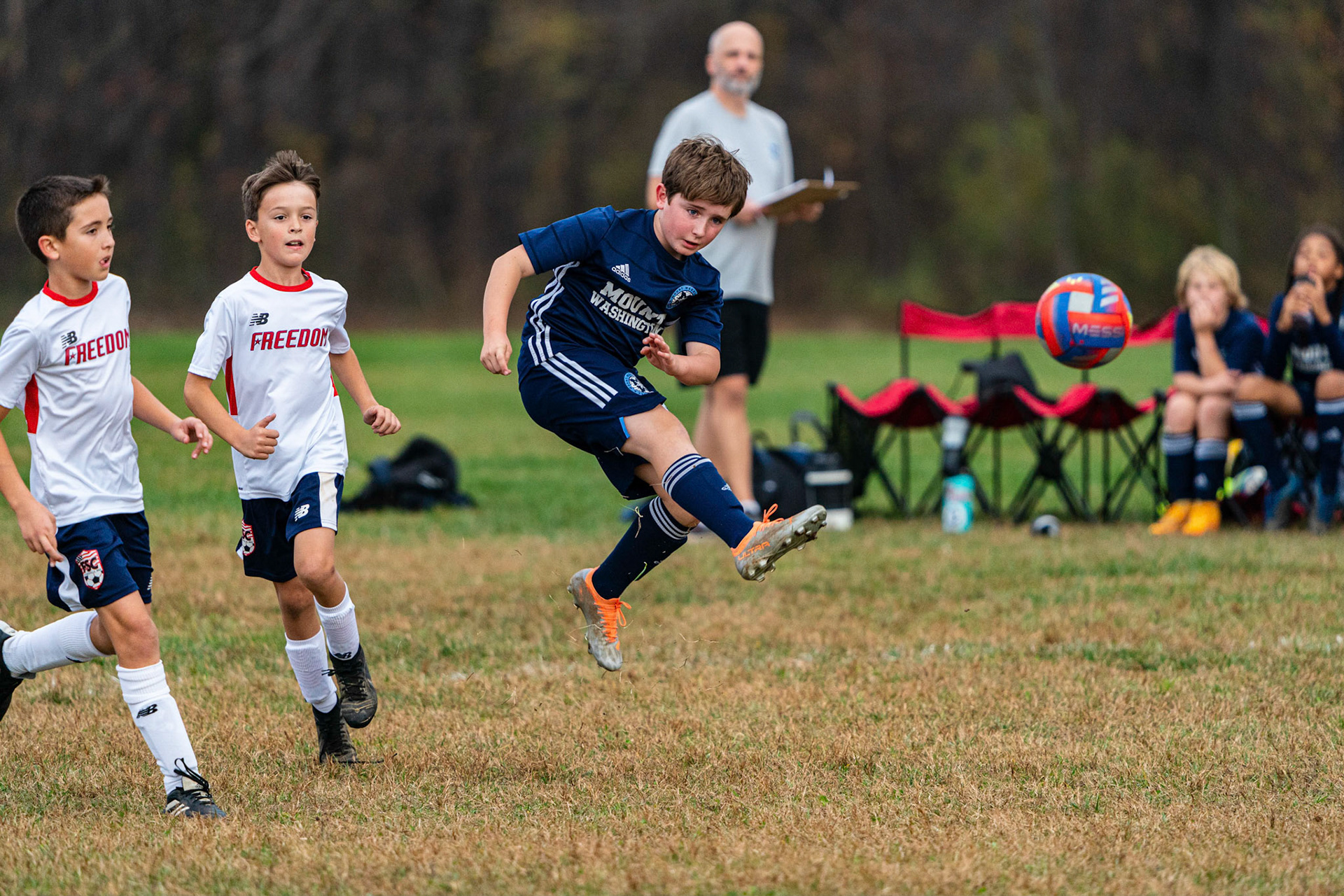Graham acrobatically sends the ball upfield as Mt. Washington defeats Freedom SC 2-1 in their final game of fall 2022.