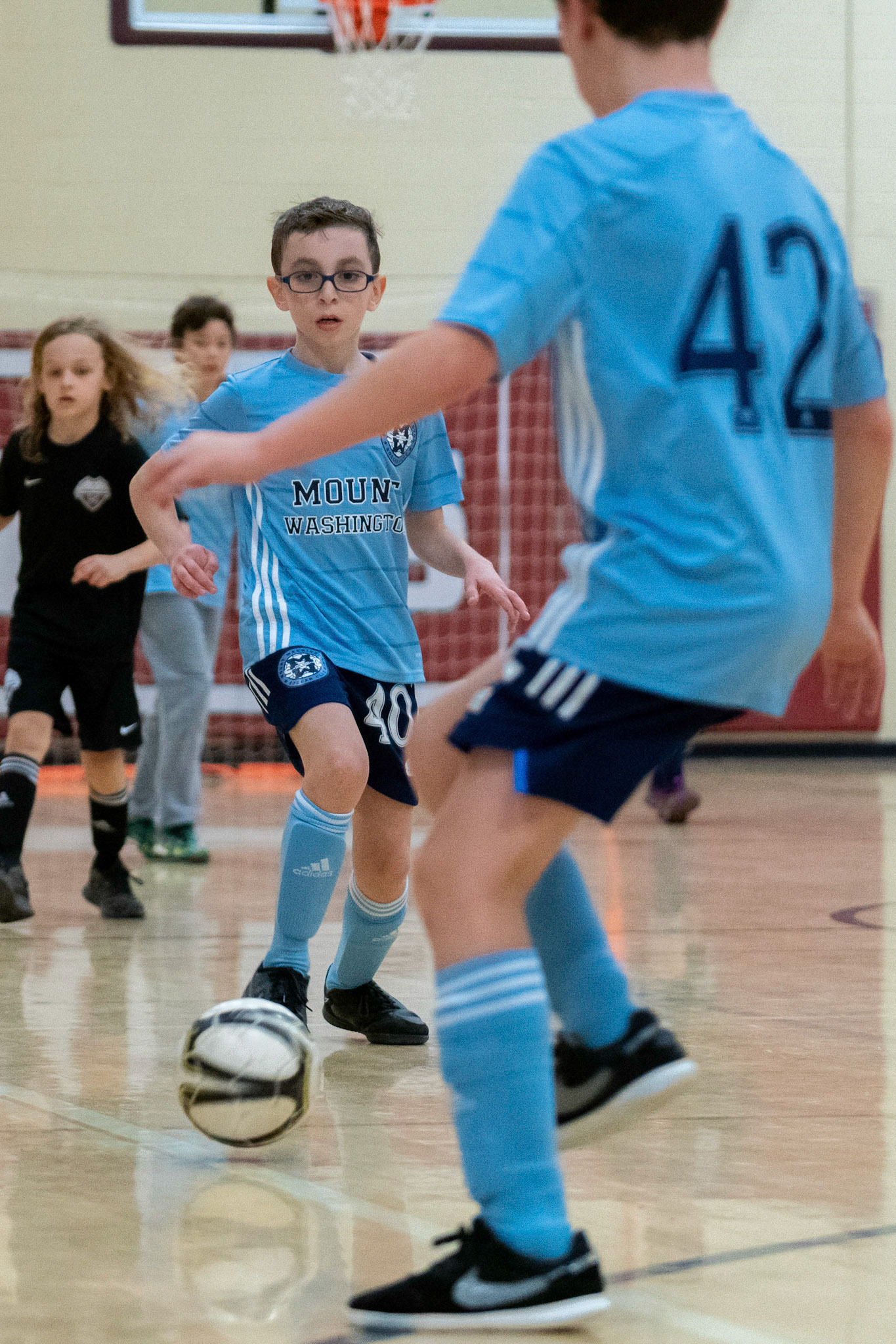 Jonah passes to Cameron in the second half of the Mt. Washington Soccer 22/23 12-5 victory over  Towson United. Each player scored.