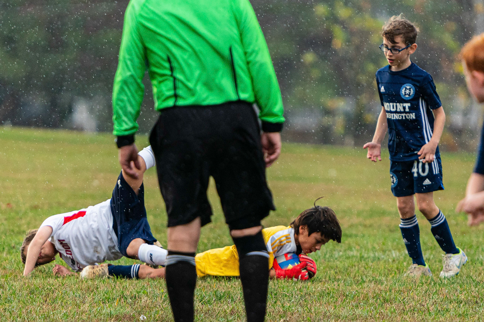 Gordon snags the ball upending a Freedom attacker at the same time as Mt. Washington defeats Freedom SC 2-1 in their final game of fall 2022.
