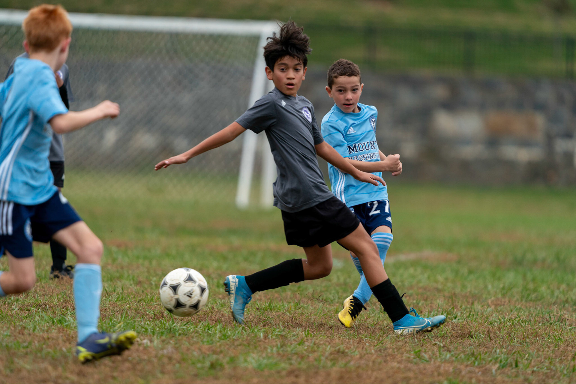 Simon threads a pass to Calvin during the second half of Mt Washington's 3-1 home victory over Northwest SC on October 23, 2022.
