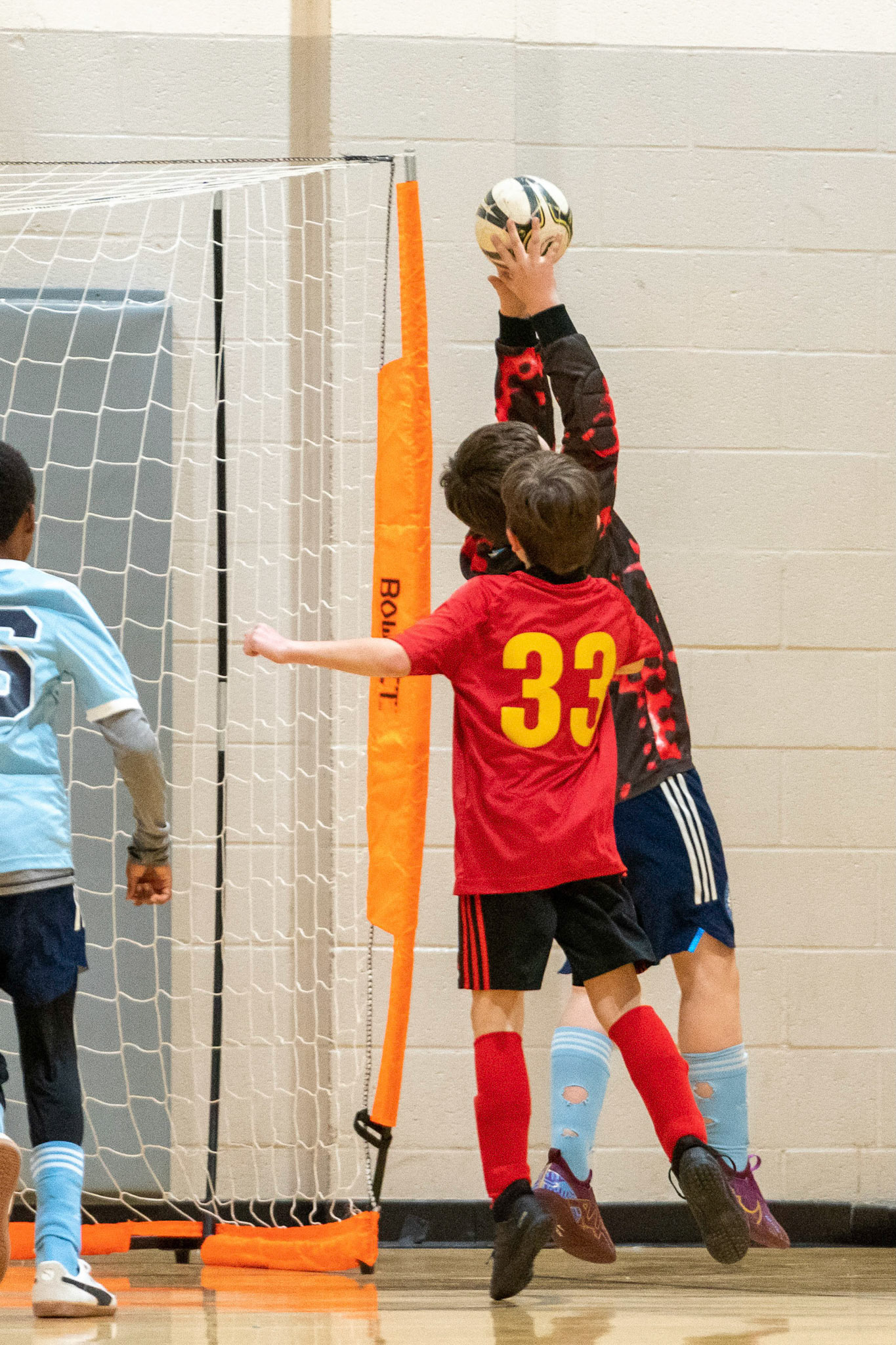 Graham makes a fingertip save in the first half of the Mt. Washington Soccer 22/23 11-3 victory over  Charles Village.