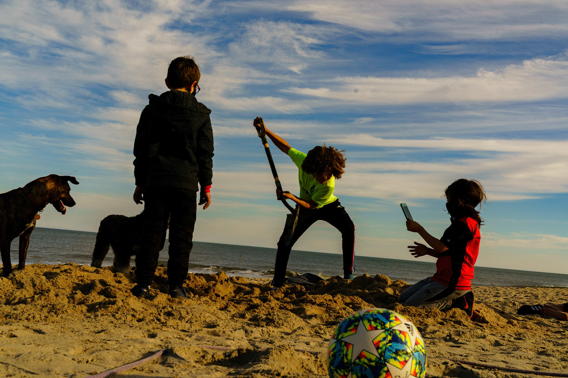 New Year’s trip to the beach. Playing at the beach. Buried little ones.