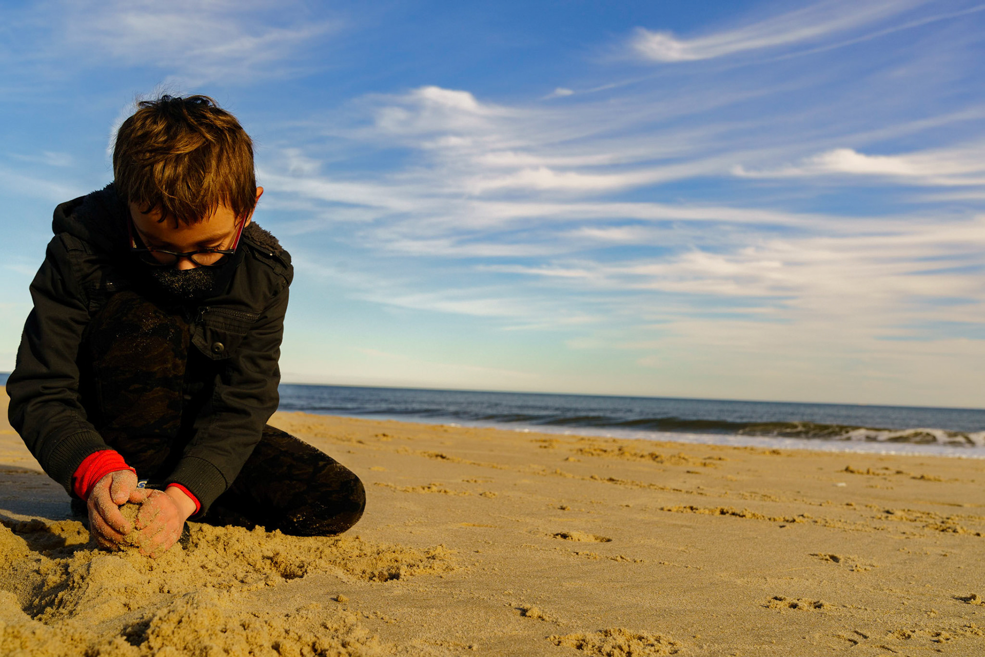 New Year’s trip to the beach. Playing at the beach. Buried little ones.