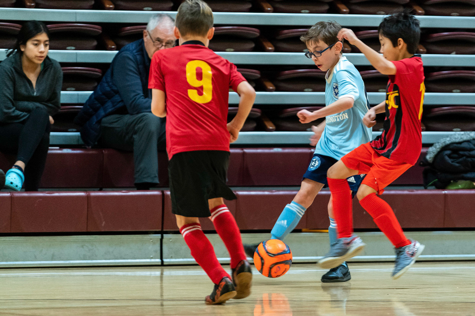 Jonah crosses the ball, splitting defenders, as Mt Washington defeats Charles Village Black 11-3 on Saturday, February 18, 2023.