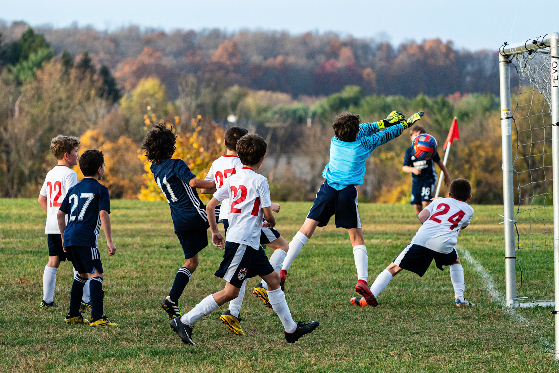 Graham continued his excellent corner kick service as his delivery is knocked into the goal by Freedom in the second half as Mt. Washington defeats Freedom SC 2-1 in their final game of fall 2022.