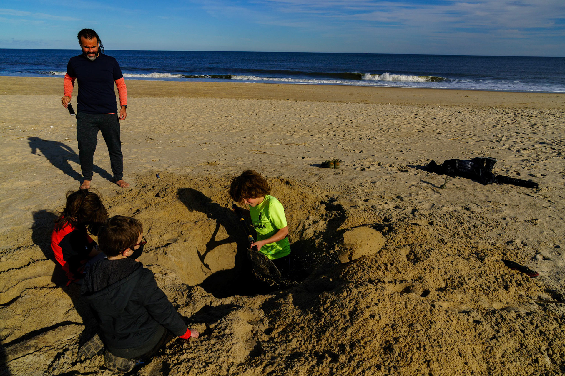 New Year’s trip to the beach. Playing at the beach. Buried little ones.