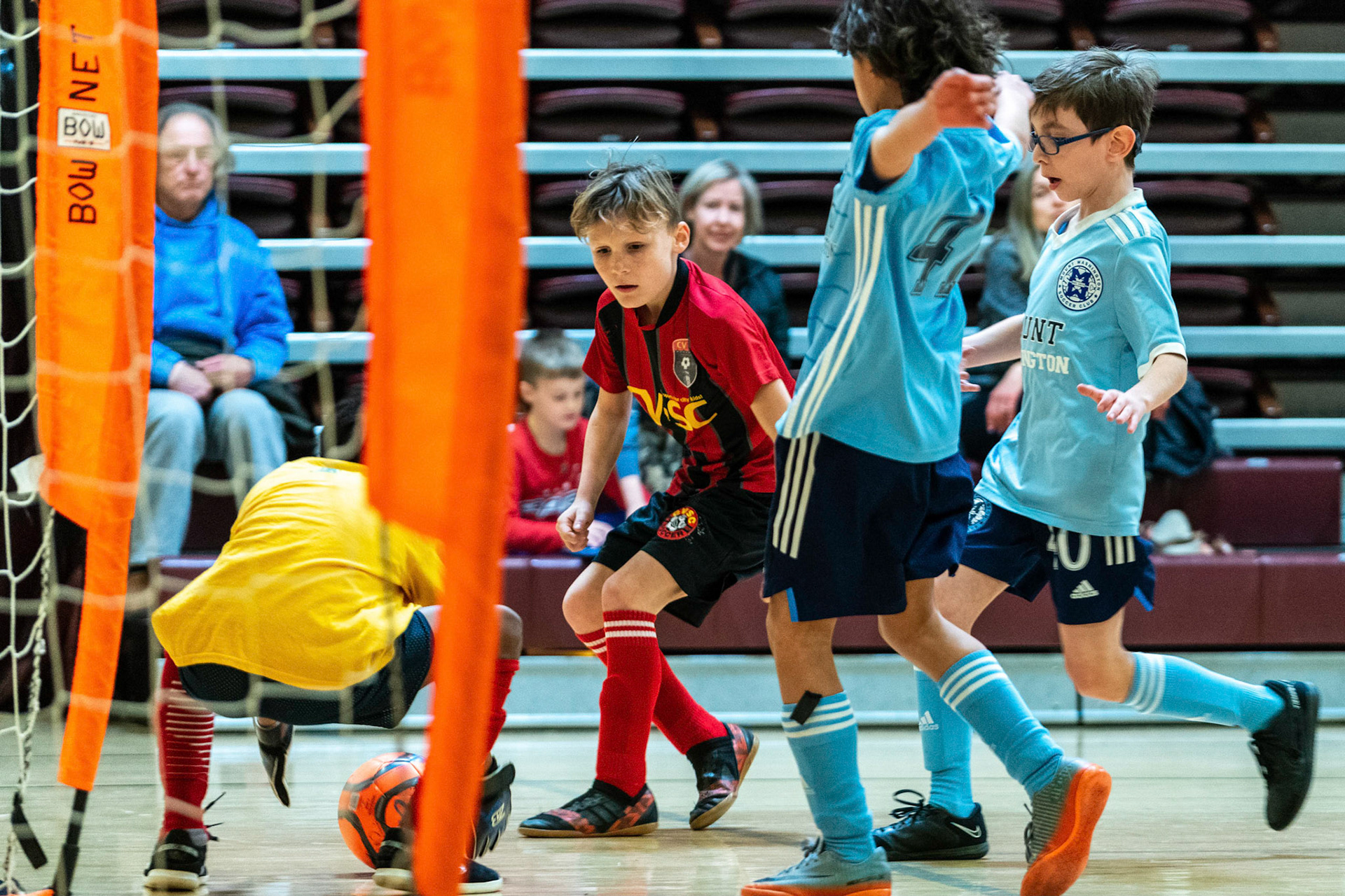 Anderson and Jonah attack the goal as the opposing goalie receives the ball as Mt Washington defeats Charles Village Black 11-3 on Saturday, February 18, 2023.