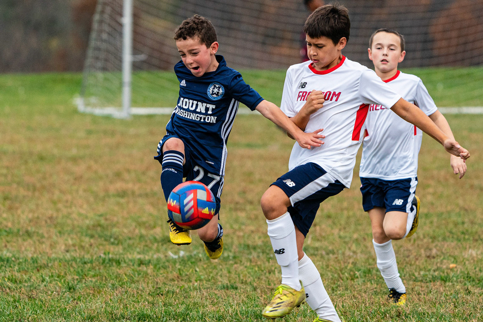 Simon avoids the defending Freedom player as Mt. Washington defeats Freedom SC 2-1 in their final game of fall 2022.