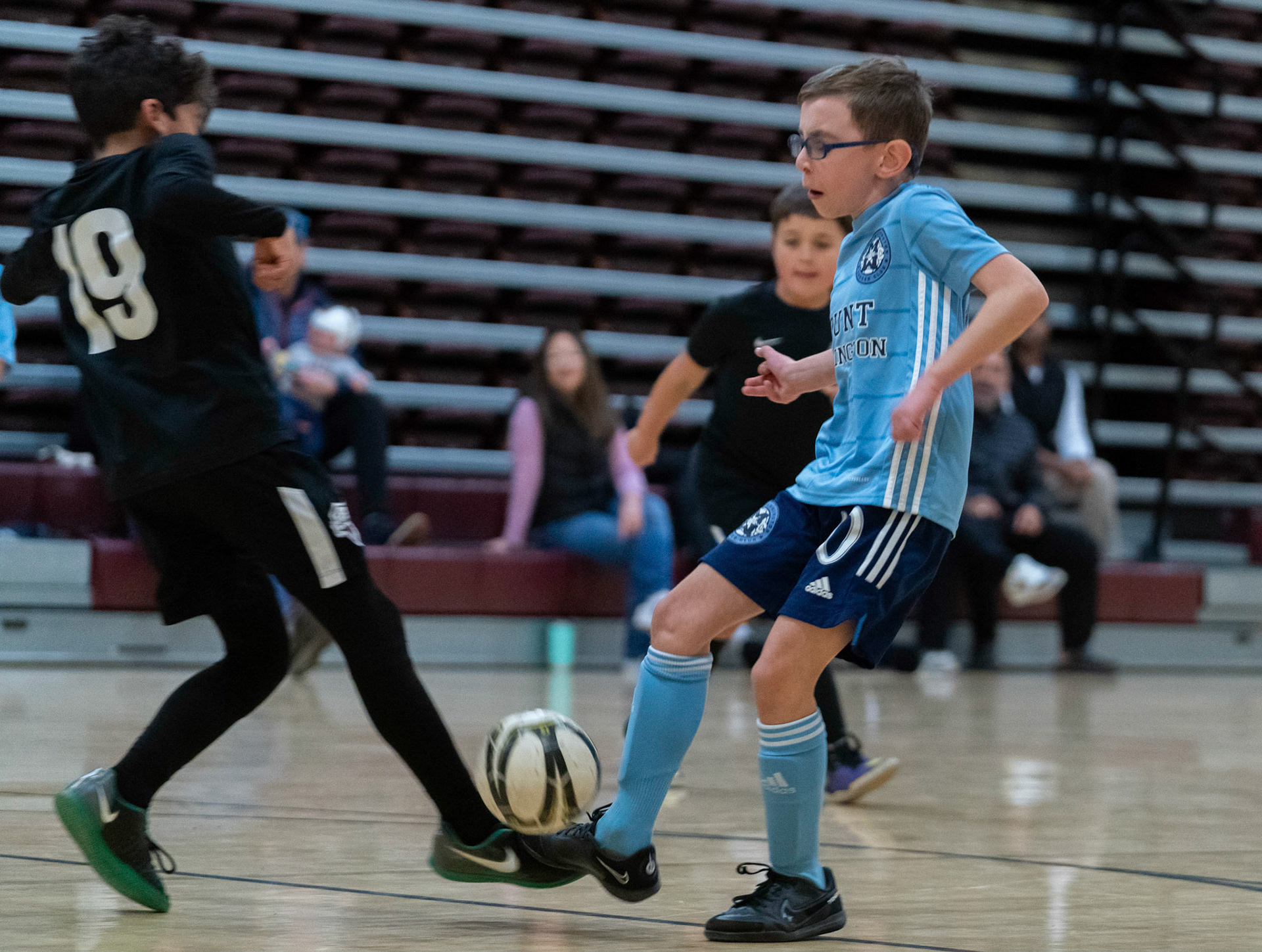 Jonah meets a stout foot in the first half of the Mt. Washington Soccer 22/23 12-5 victory over  Towson United. Each player scored.