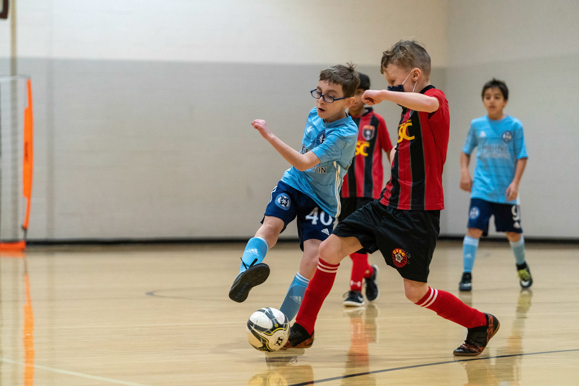 Jonah tries to keep the ball in the attacking end in the first half of the Mt. Washington Soccer 22/23 11-3 victory over  Charles Village.