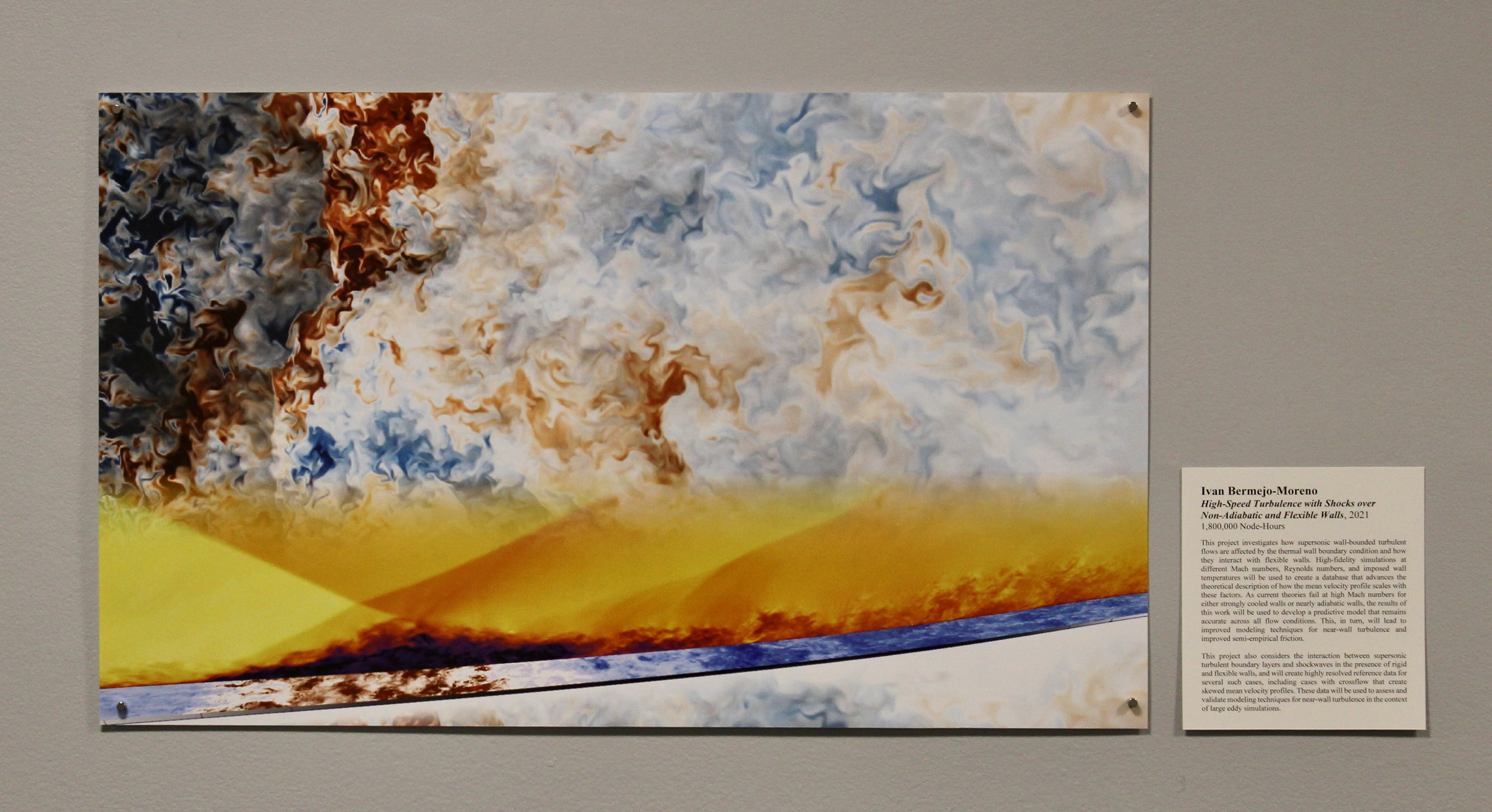 Data visualization of high-speed turbulence with shocks. Cloudy and smoky organic shapes in blue, white, and red/orange, divided horizontally by a yellow/orange strip.