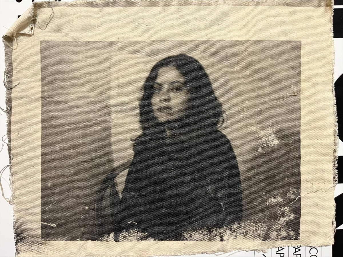 Black and white photograph on canvas of a seated woman