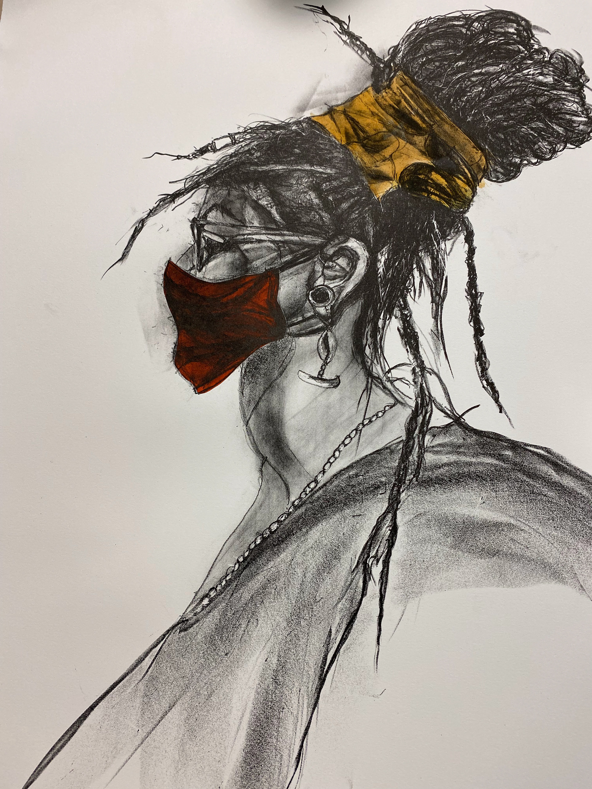 An exaggerated printed image of a woman in side profile wearing a mask, jewelry, and her hair up in a bun with a wrap. The print is black and white except for the mask which is red and the wrap which is yellow.