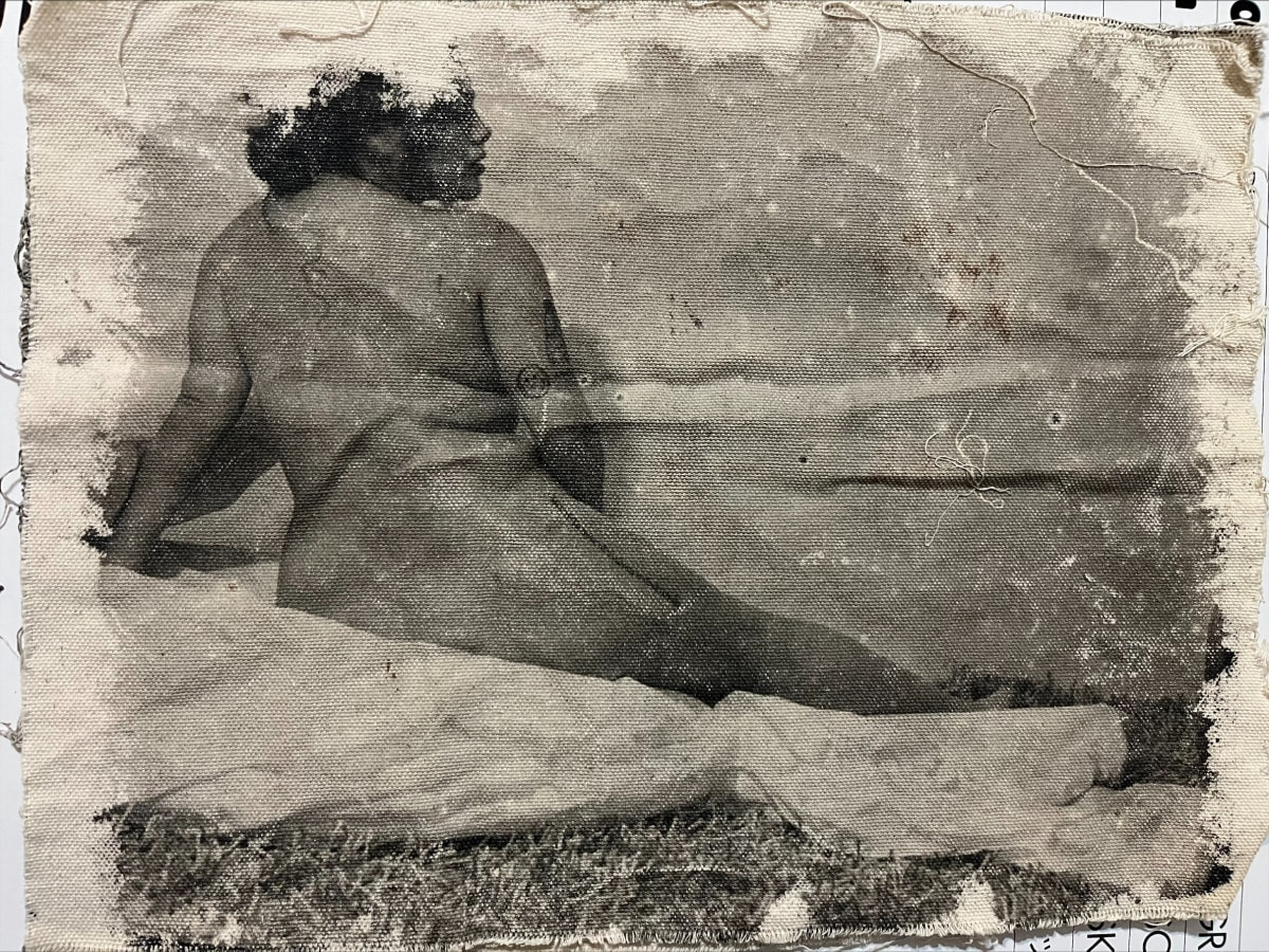 Black and white photograph on canvas of a lounging nude woman from behind