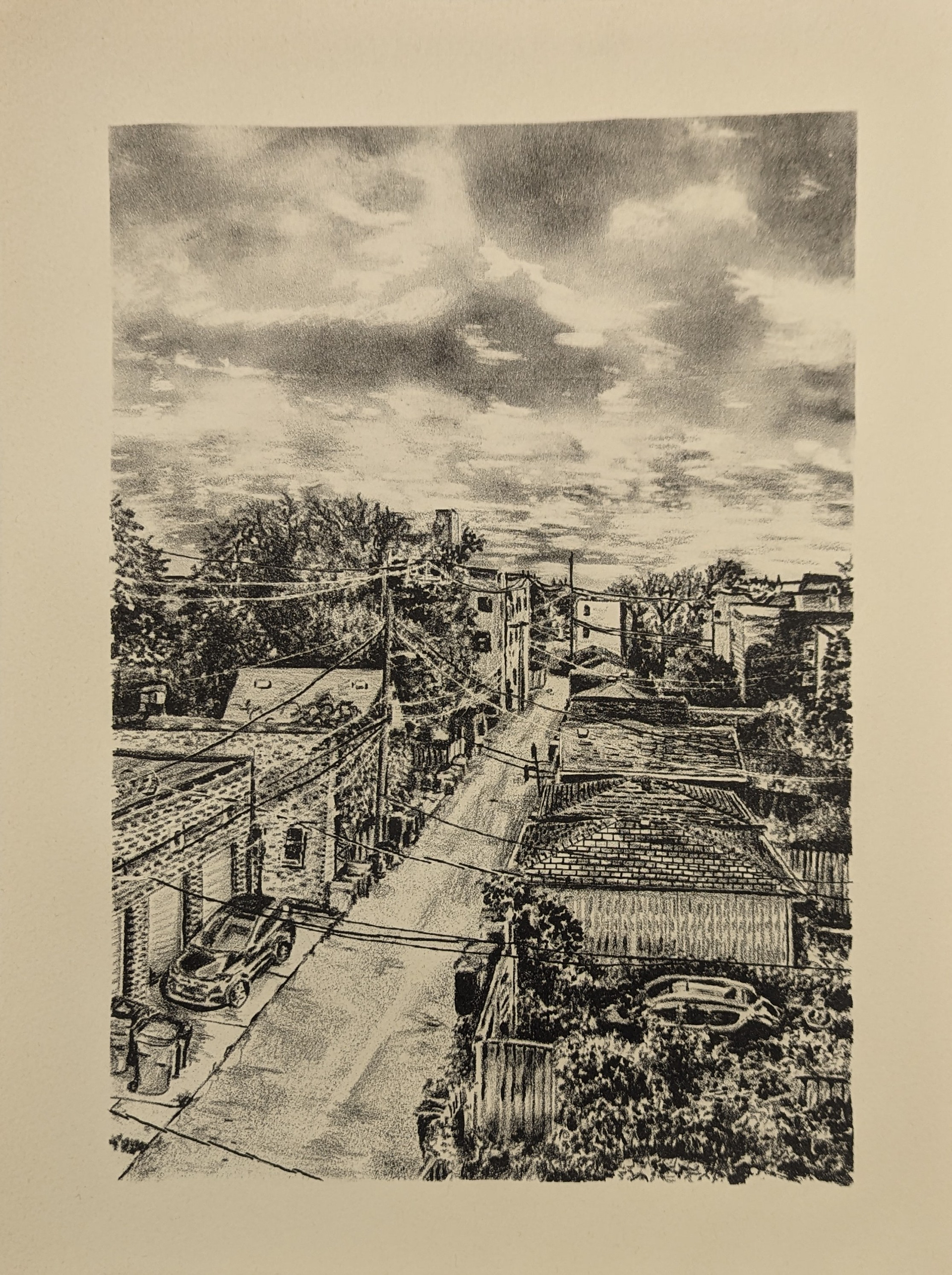 Black and white print over a beige paper of a neighborhood alley with power lines, garages, trees, and a parked car
