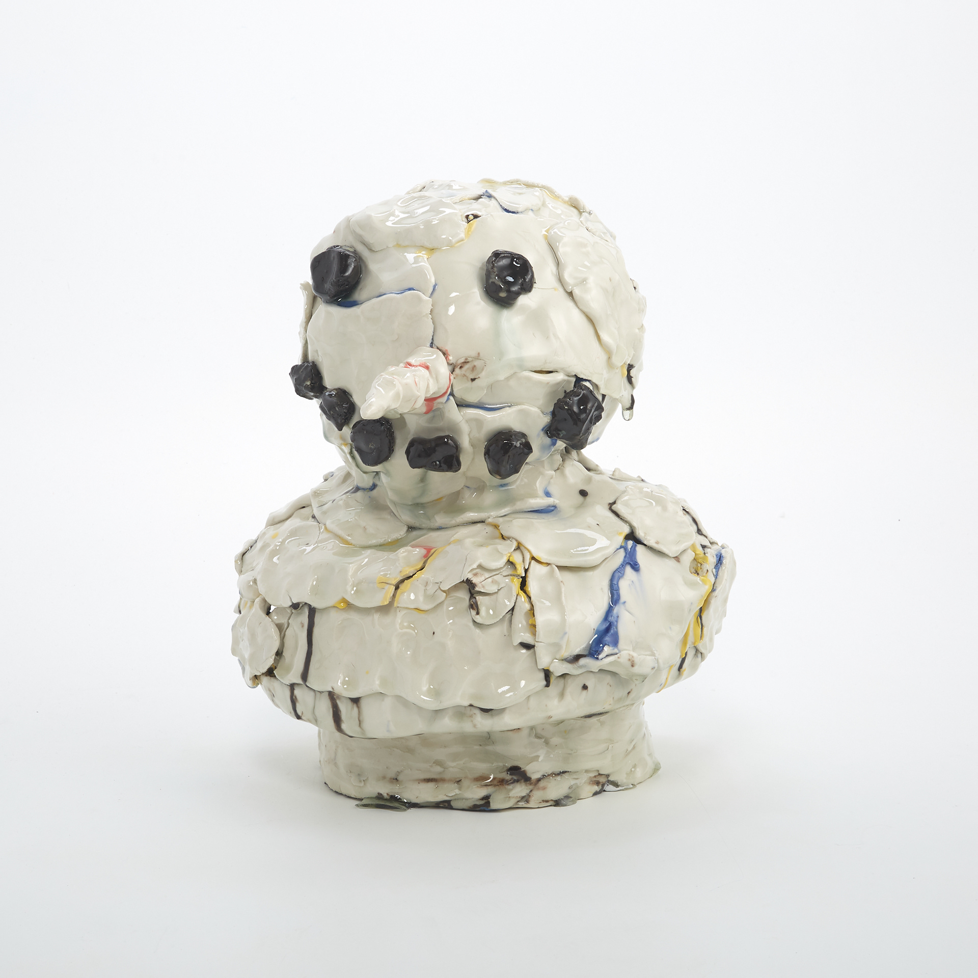 Porcelain sculpture of the top half of a snowman made from many small, rugged, and chipped pieces.