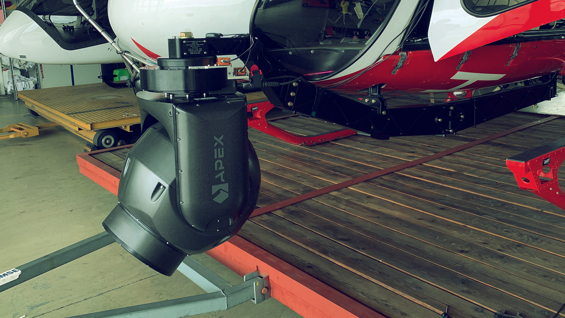 The AX18 stabilized camera gimbal on a AS350 Helicopter