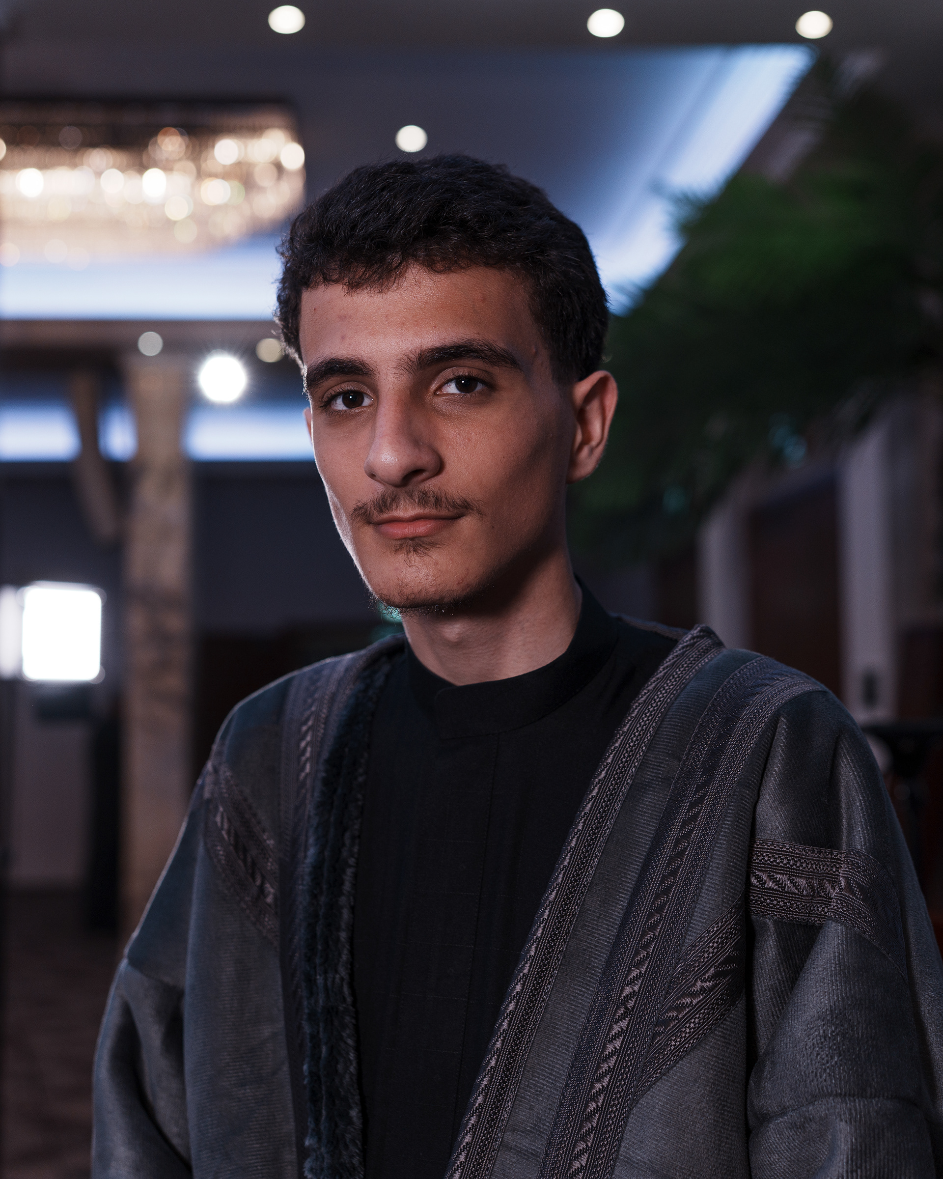Mohammad Ali (16 years old) is the videographer and live streaming technician at Al- Harakah Al-Hussainiyah. He was born and raised in London. His father migrated from Iraq, Twaireej City, in 1989 because Saddam Hussein’s regime. He started volunteering in Al-Harakah Al- Hussainiyah since he was 13. He didn't know how to use the camera at first, then he learned gradually until he mastered the craft. "It is not a matter of just operating the camera, it is the problem solving you need to do to make the best use of the light available to you" Mohammad said. He added "Volunteering here gave me the soft skills I need that will distinguish me InshaAllah when I finish my A-levels and pursue a college degree". Mohammad aspires to become a pilot one day.