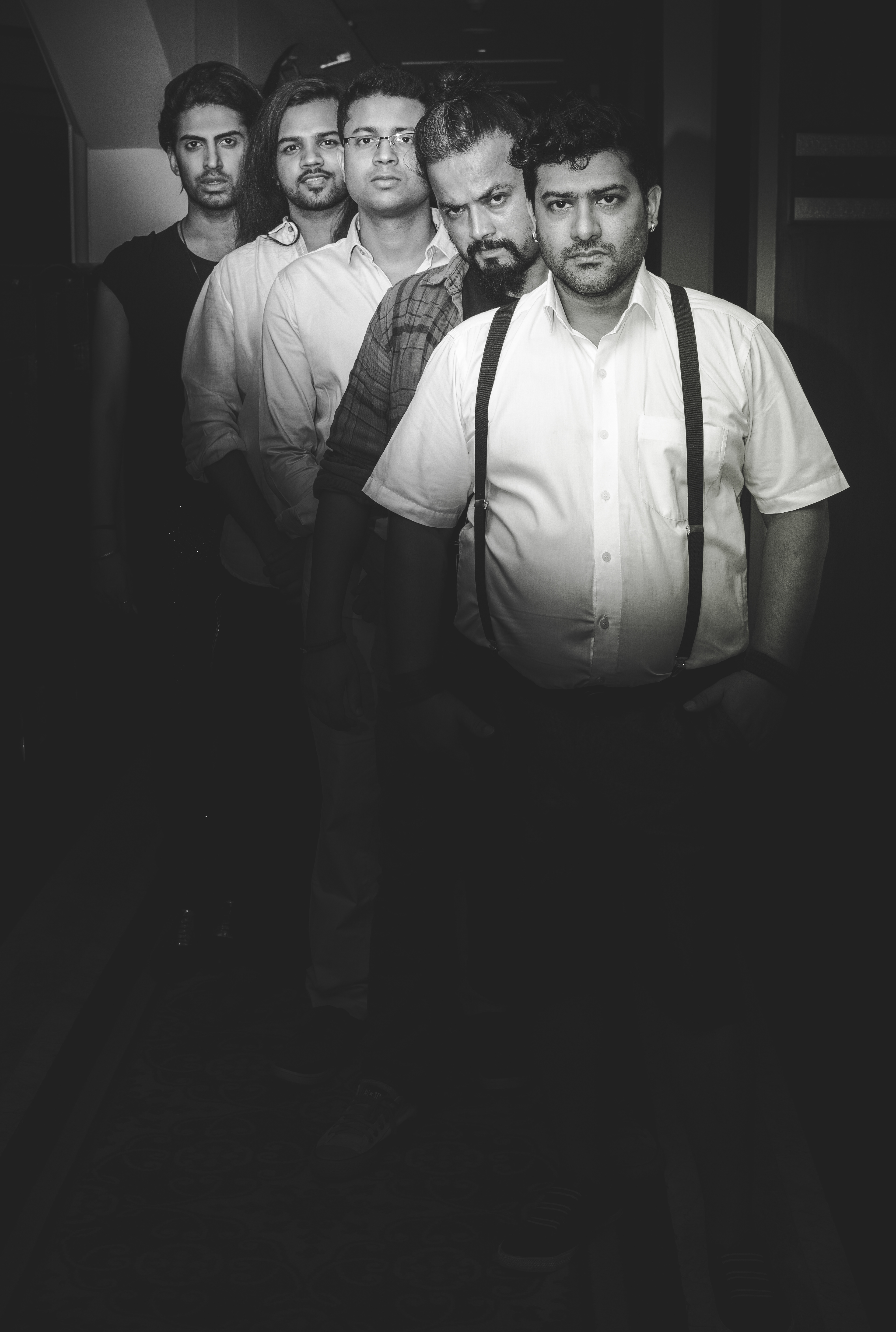 Group portrait of TOP STOREY Band members during a creative photoshoot in Mumbai