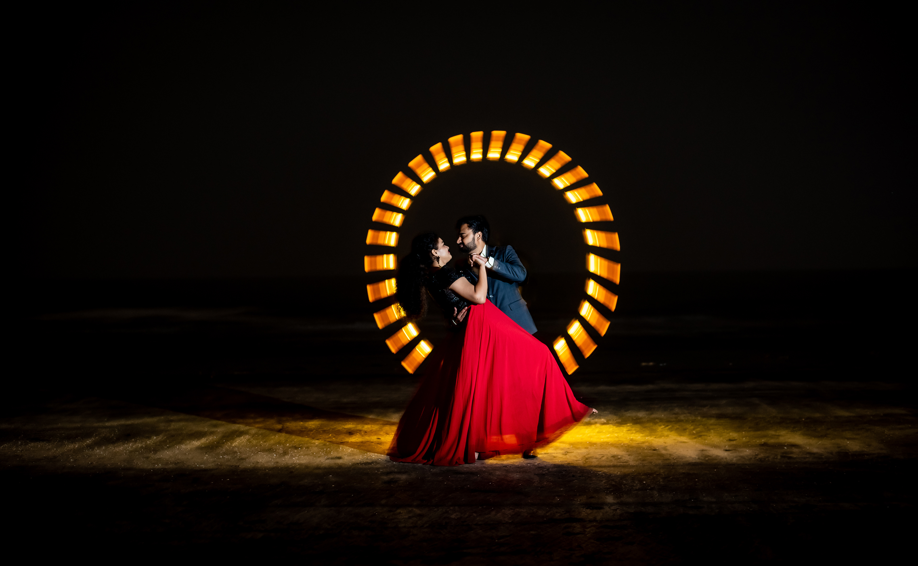 Artistic pre-wedding photography with dramatic lighting and cinematic styling