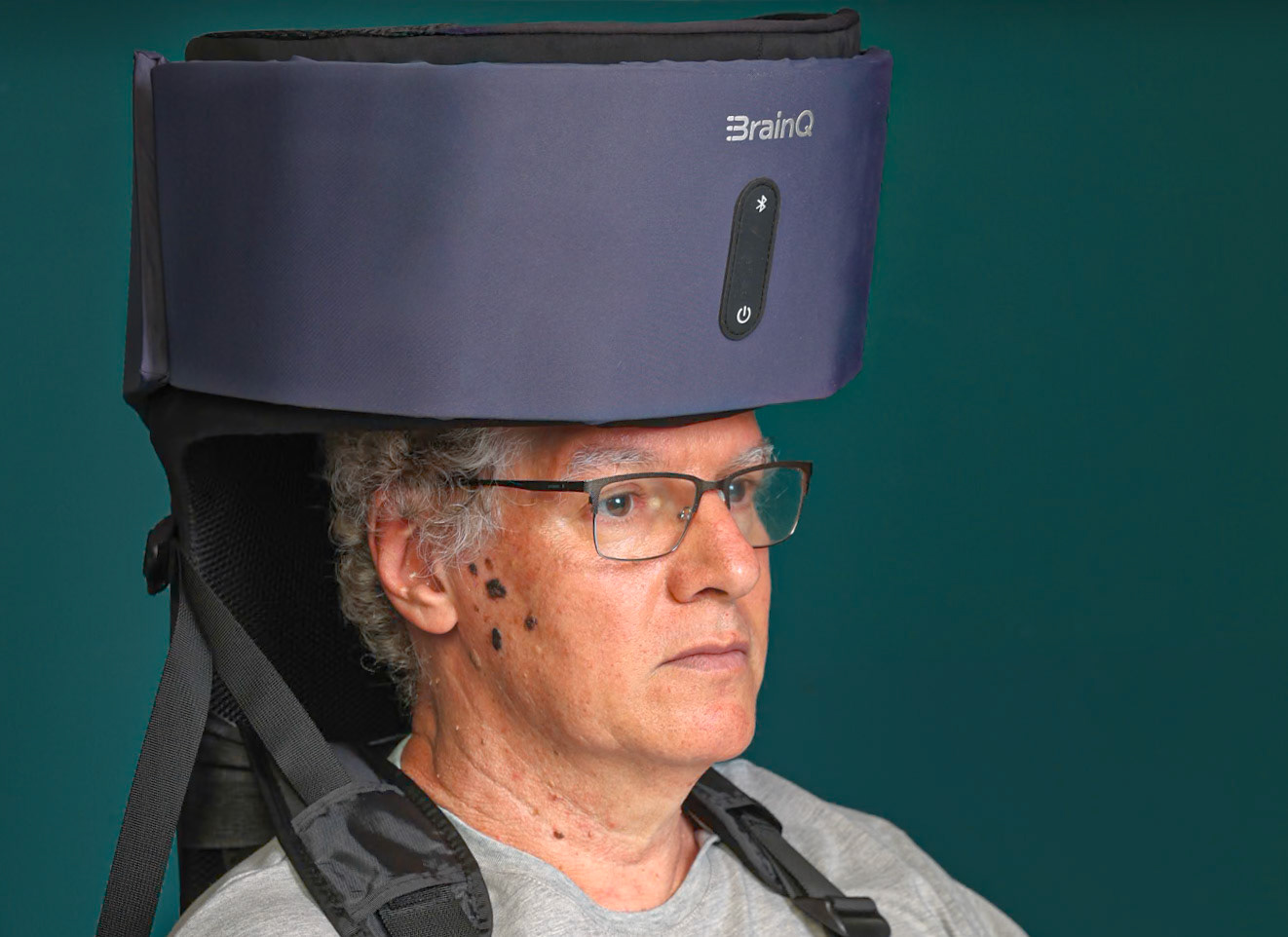 Inventor Yaron Segal with three generations of the BrainQ device.