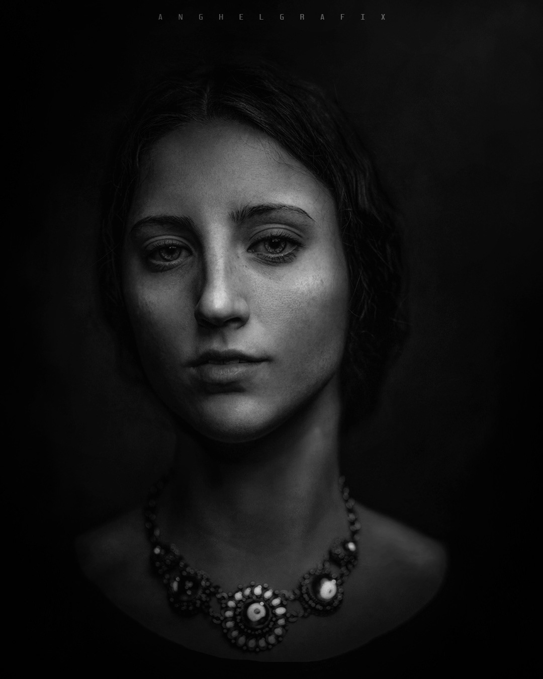 A female monochrome portrait with dramatic and artistic lighting giving a painterly look to the imagery.