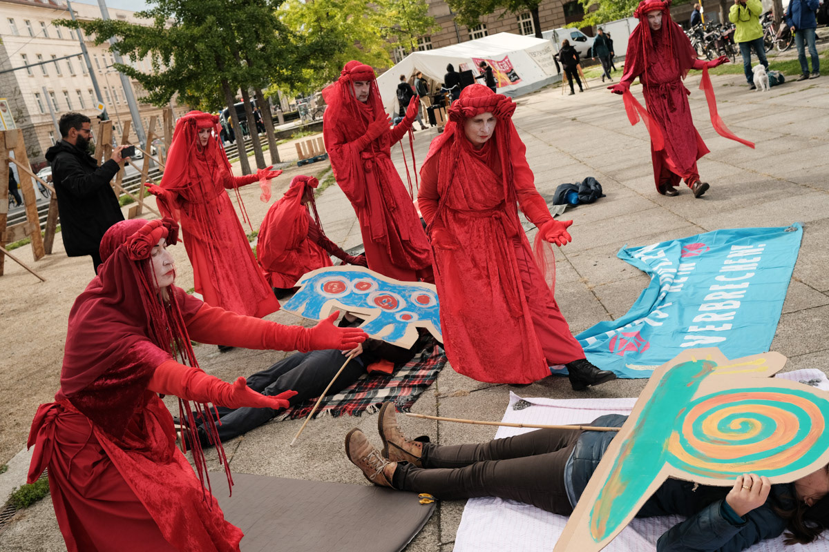 A performance by the "Red Rebels" of Extinction Rebellion.