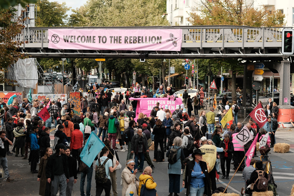 A "Street Festival" blocks a major intersection in Kreuzberg, Berlin.