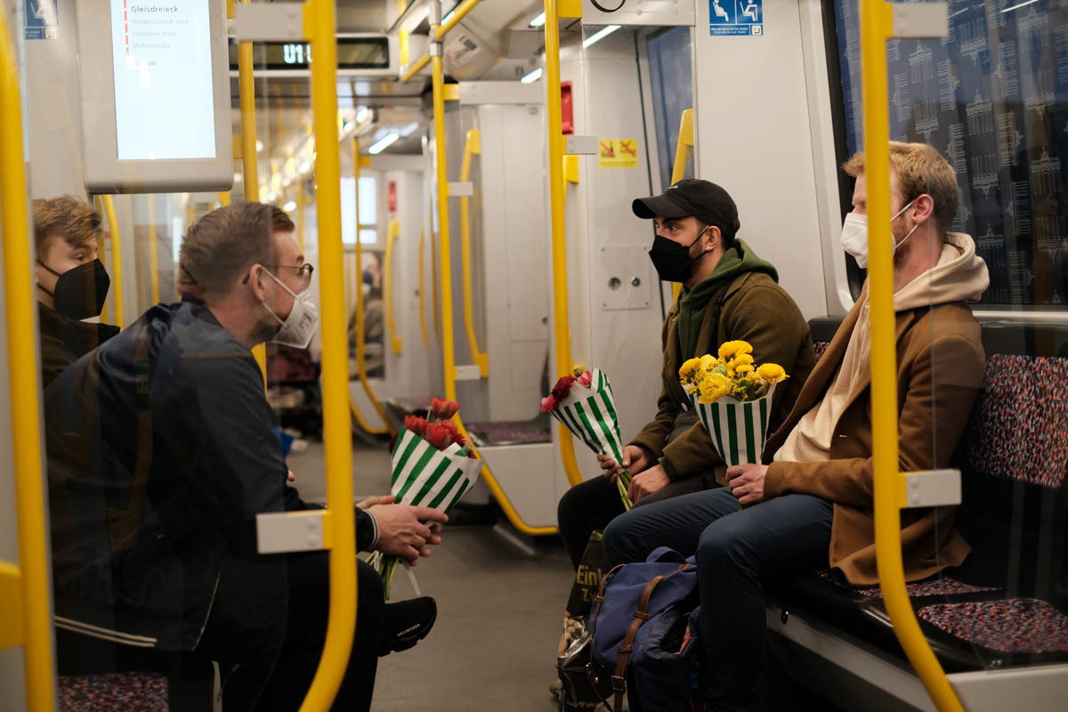 Young men with flowers. Berlin, April 2022