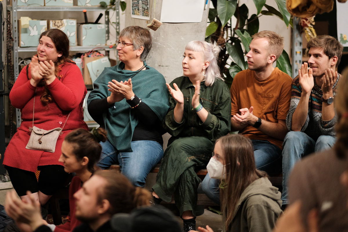 Activists listen a woman declare she is willing to go to jail