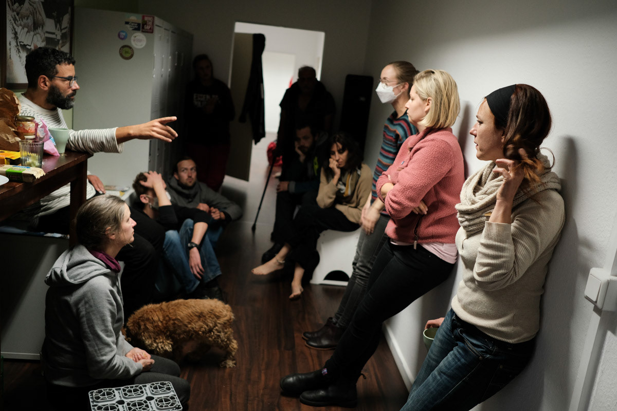 Activists debrief after a day of protesting.