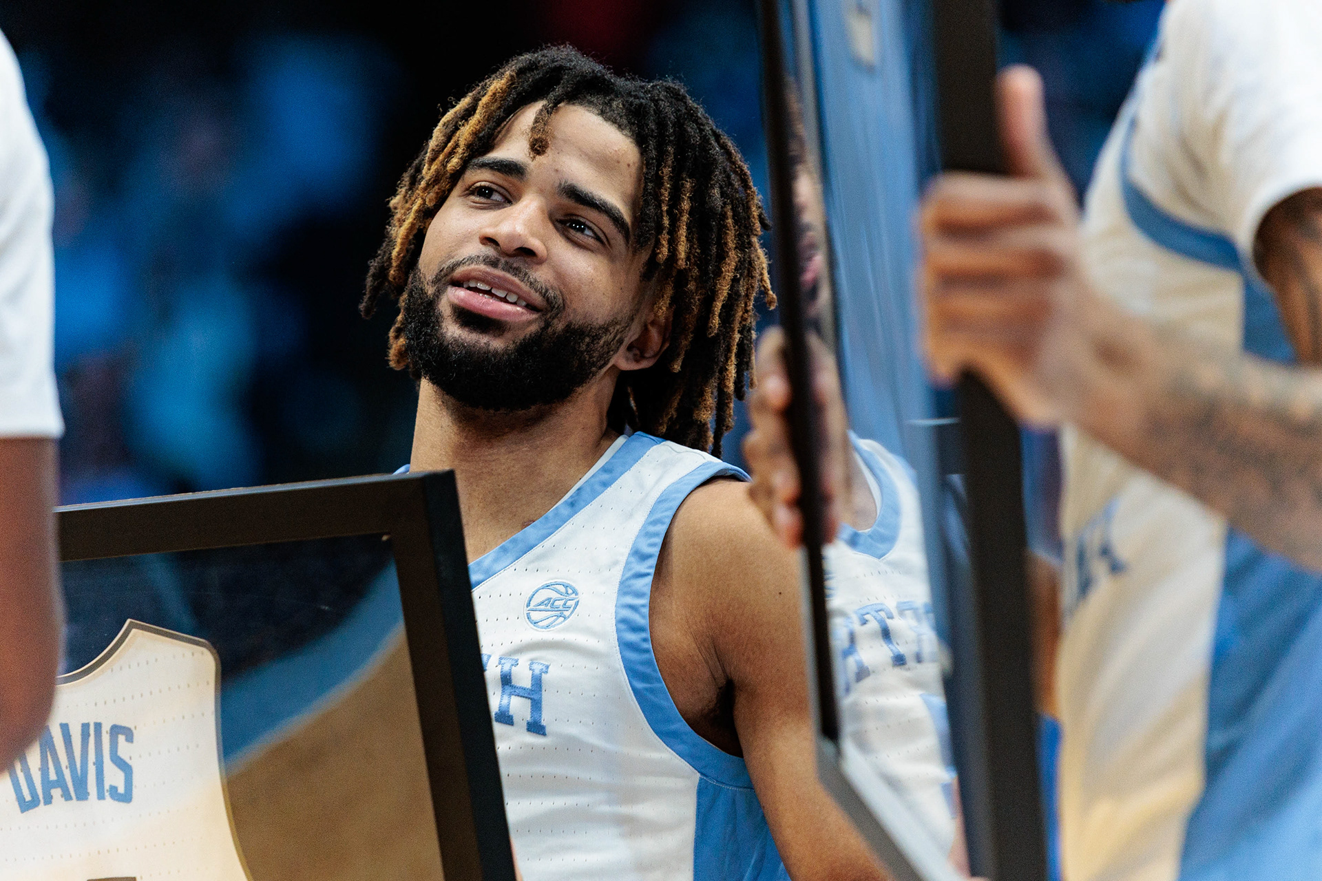 UNC graduate-student guard RJ Davis (4) celebrates with his teammates and family during a pre-game senior night celebration during the men’s basketball game against Duke on Saturday, March 8, 2025 at the Dean Smith Center. UNC lost 82-69.