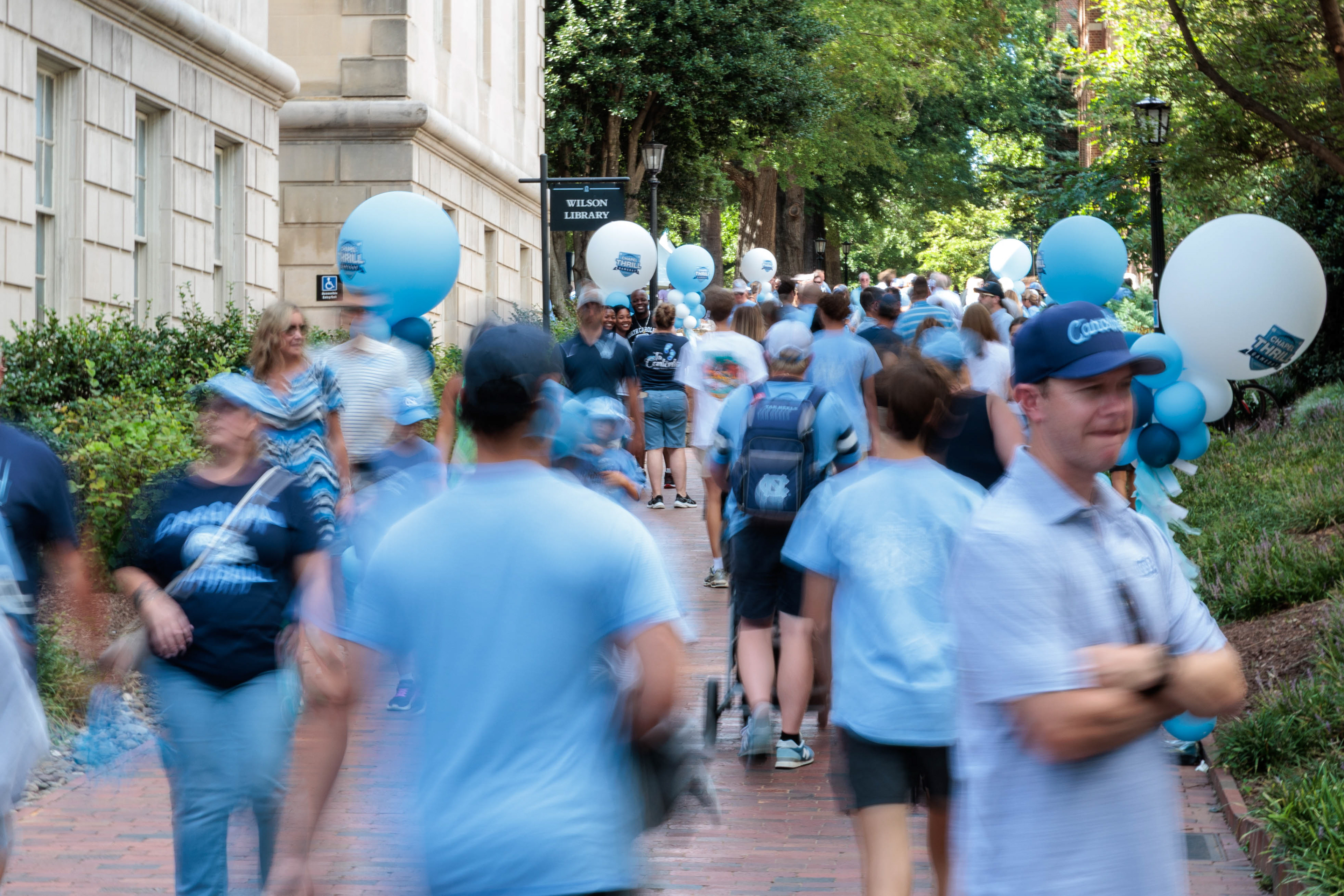 People walk by Wilson Library during the Chapel Thrill pre-game events prior to the UNC football game against TCU on Monday, Sept. 1, 2025.