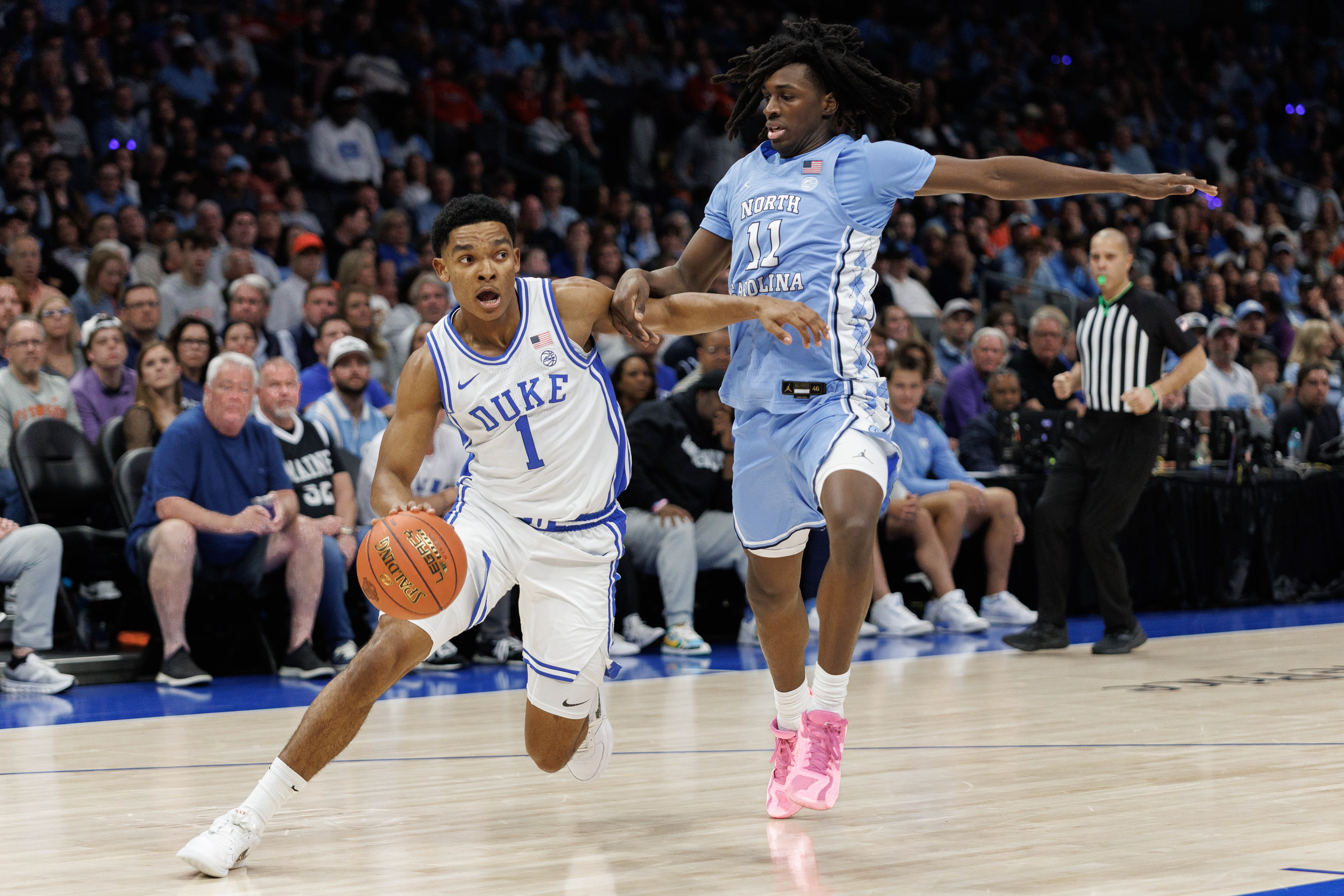 UNC first-year guard Ian Jackson (11) struggles against Duke sophomore guard Caleb Foster (1) during the men’s basketball game against Duke during the ACC Tournament on Friday, March 14, 2025 at the Spectrum Center.