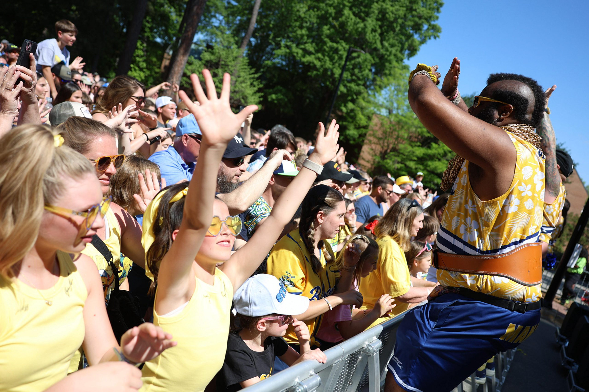 CHAPEL HILL, N.C. — The Man-Nanas cheer with fans as part of the Savannah Bananas' pre-game performance on Stadium Drive on Sunday, April 12, 2026.