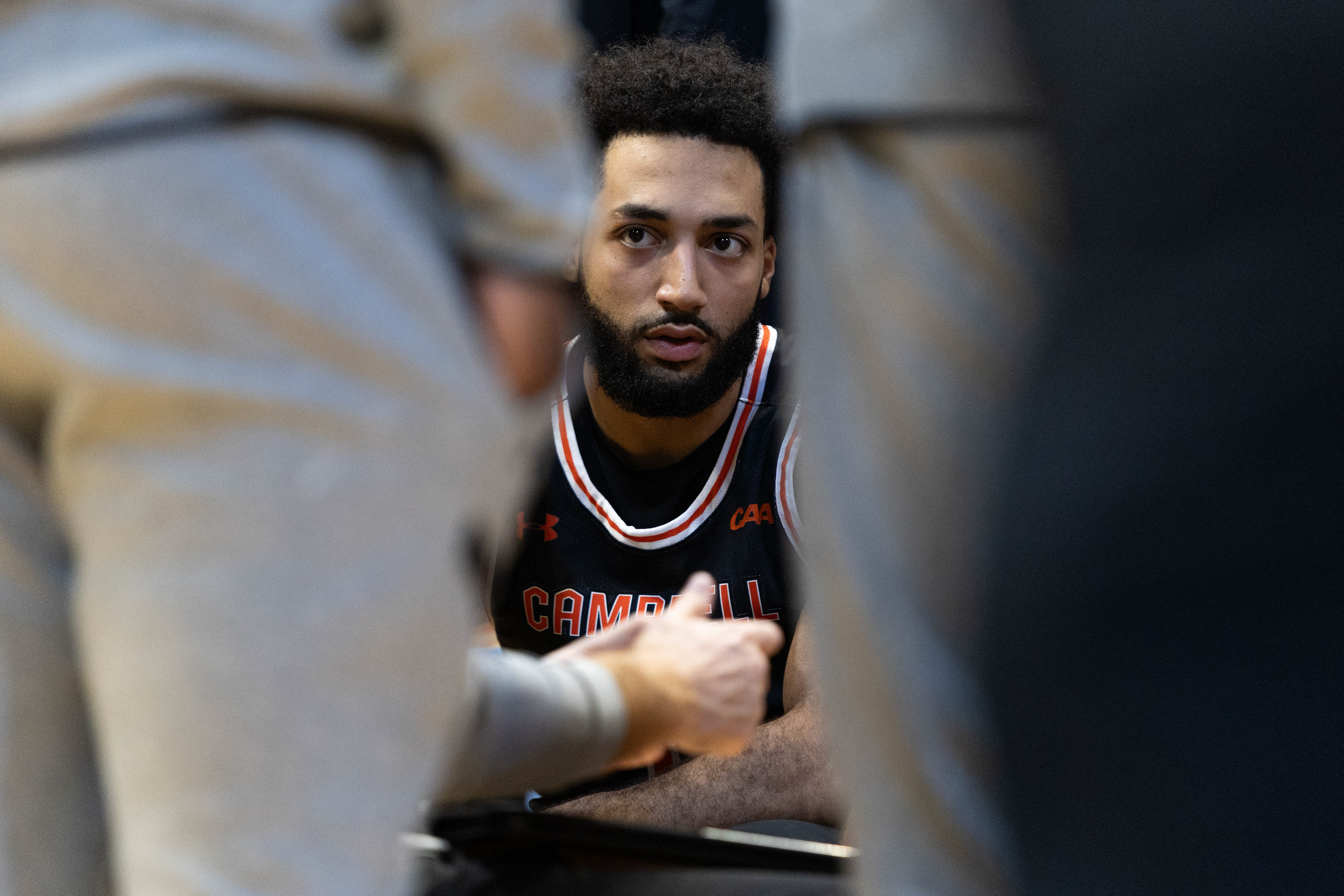 Campbell graduate guard Tasos Cook (1) speaks with his coaches during the men’s basketball game against UNC on Sunday, Dec. 29, 2024 at the Dean Smith Center.