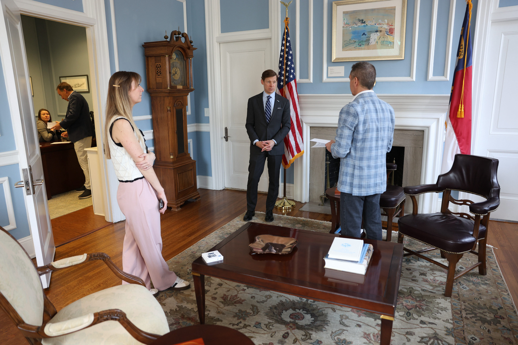 UNC Chancellor Lee Roberts finishes filming an Instagram reel with Vice Chancellor of Communications Dean Stoyer and Communications Specialist Anna Lutze, in his office at South Building on Wednesday, March 4, 2026. Roberts filmed the video quickly, and in one take, after being emailed the script earlier that morning.