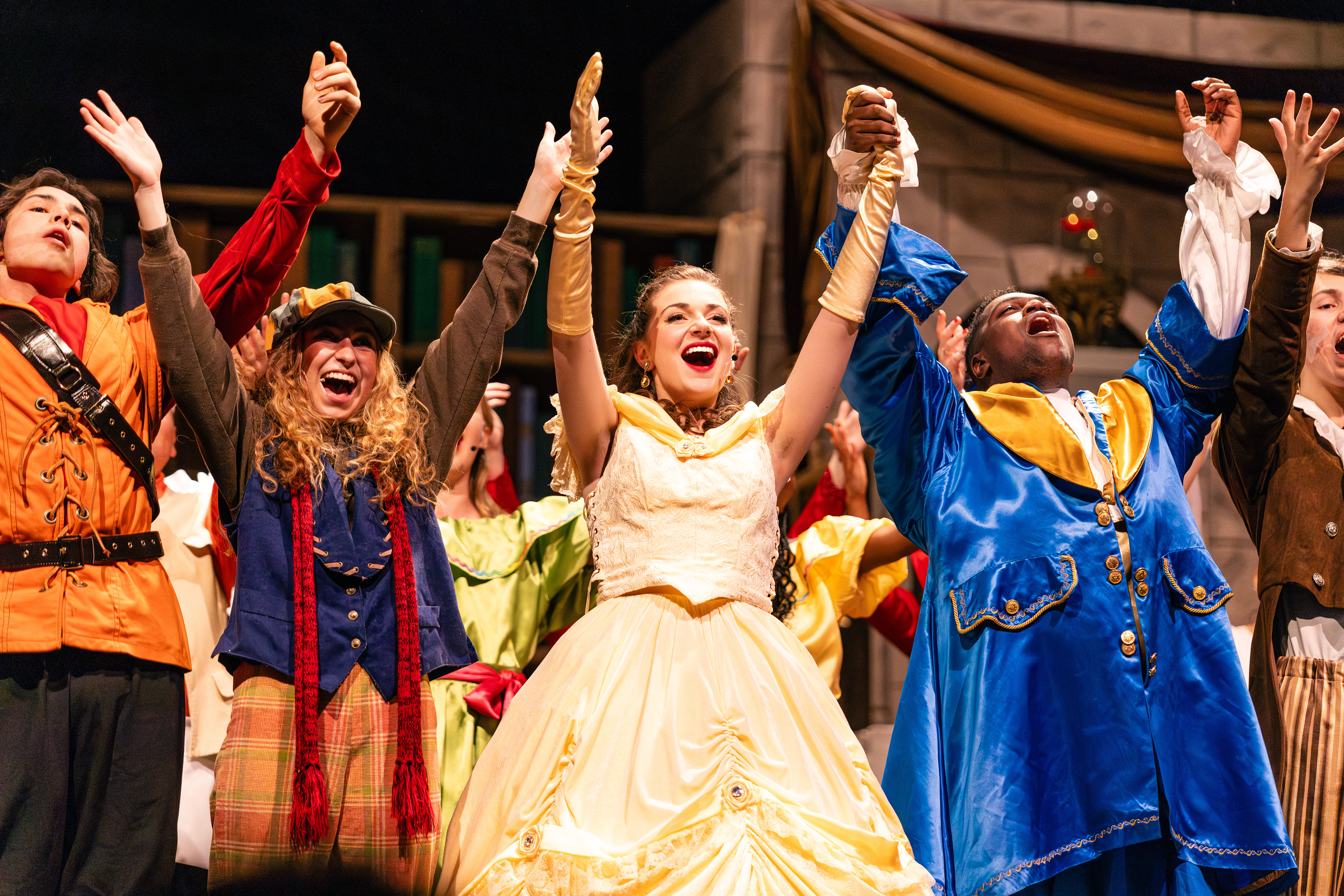 Violet Whoolery, Ava Jernigan, and Xie Atkinson celebrate after West Johnston High School's rendition of Beauty and The Beast on Thursday, Feb. 1, 2024.